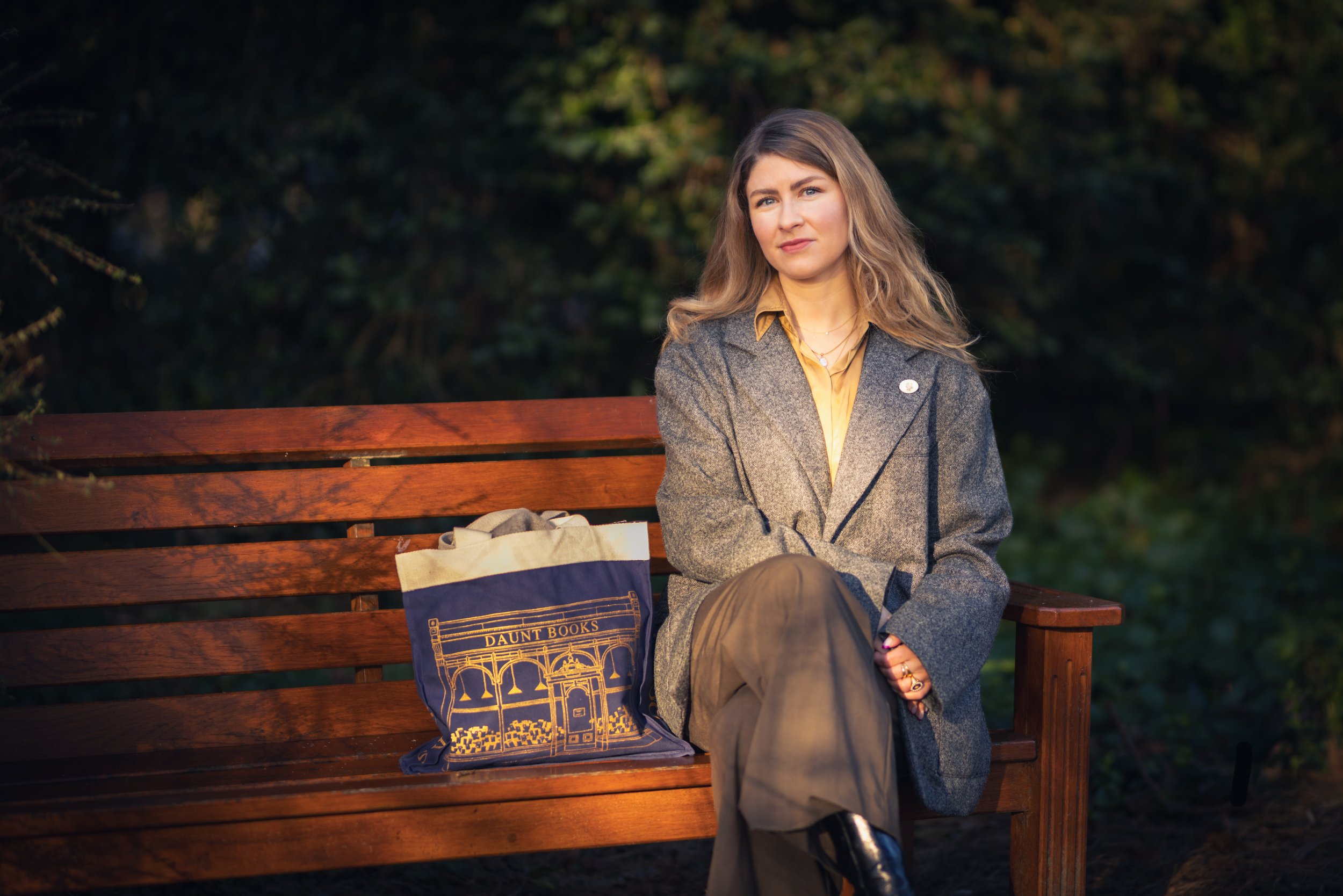 Bri L. Burt is a brand strategy expert based in Edinburgh, here in bench in Stockbridge