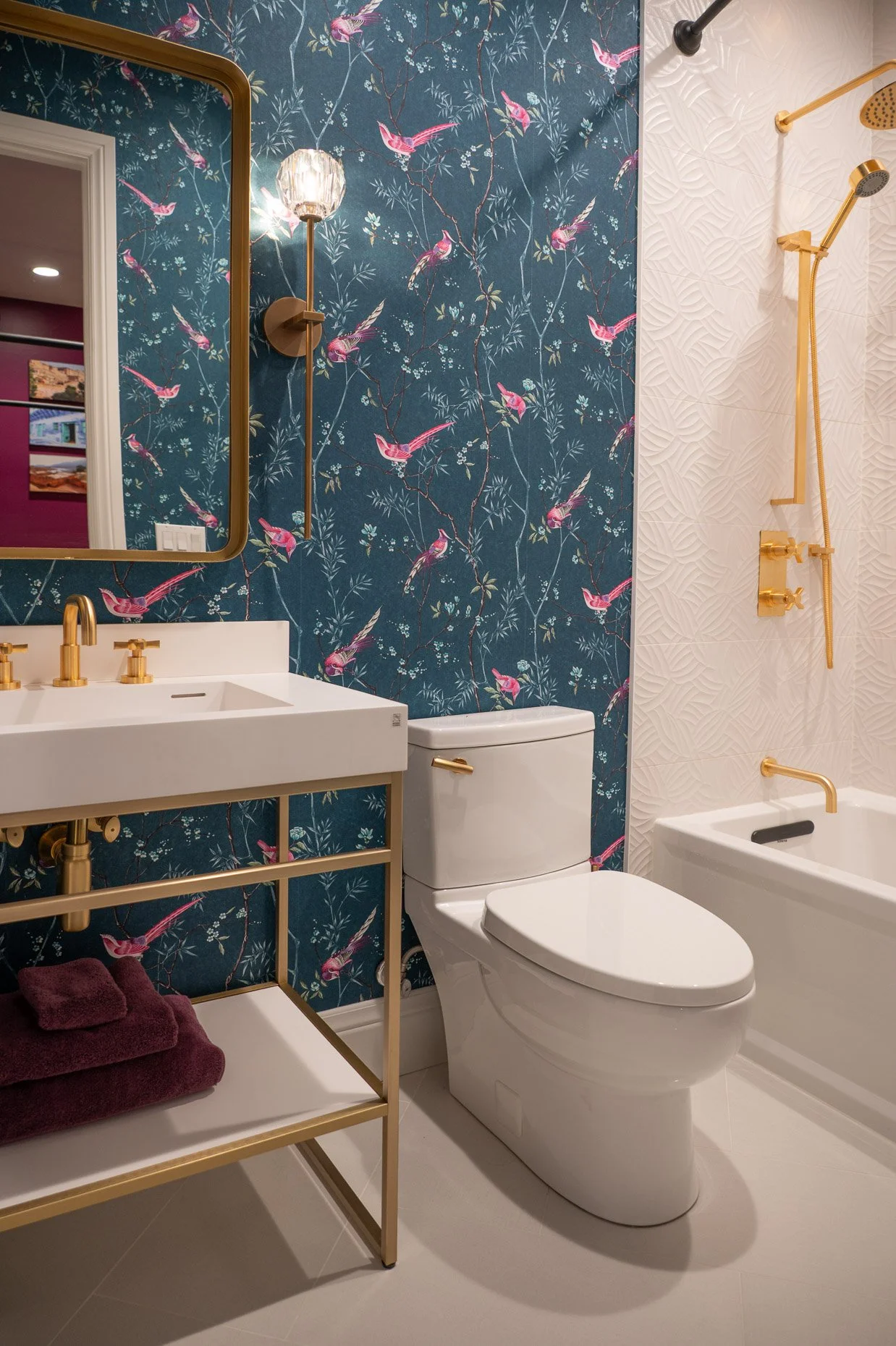 Stunning Bold Guest bath design with custom wallpaper and gold fixtures