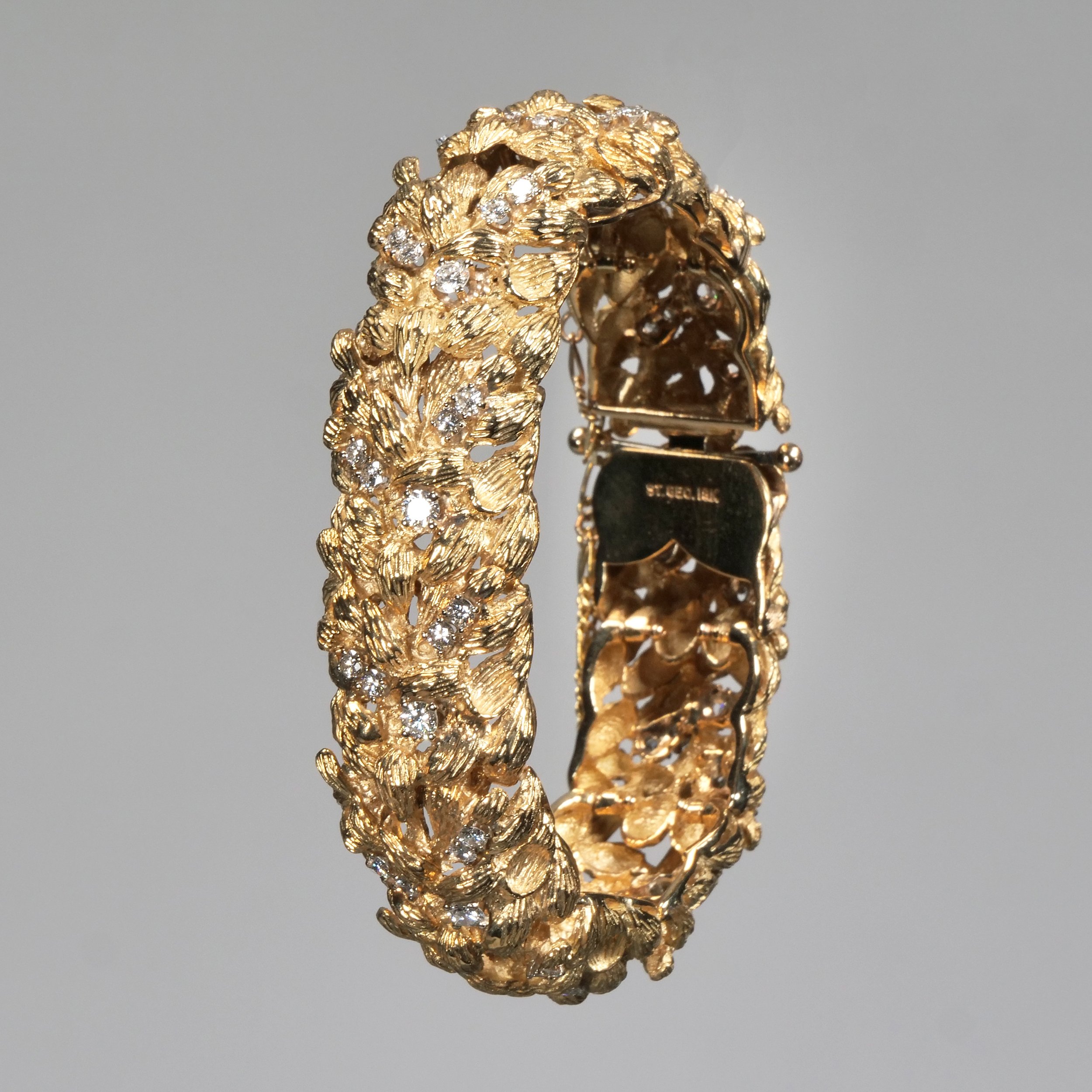"ST. GEO." DIAMOND & 18k GOLD BRACELET / HAMMER: $5,500