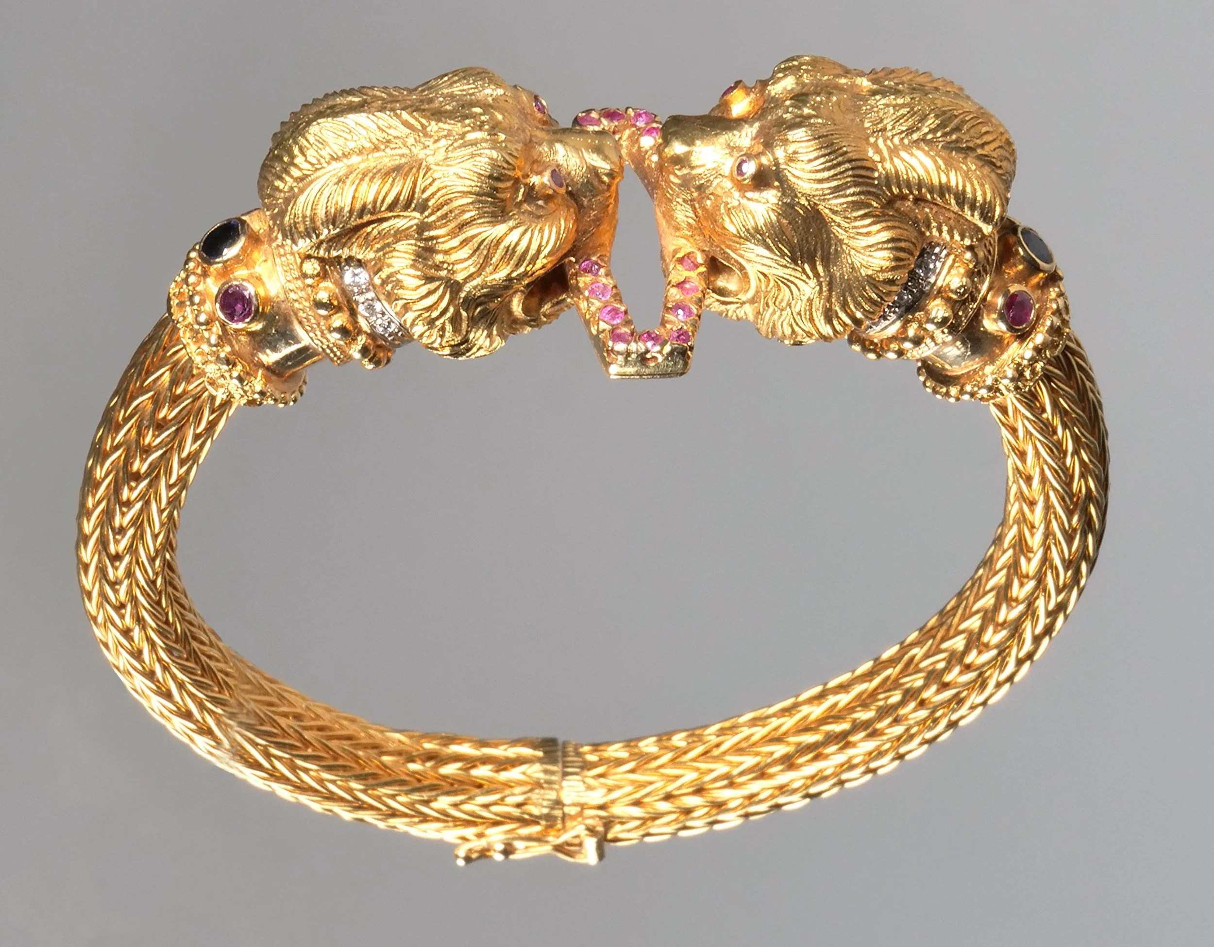 A GREEK 18k & GEMSTONE FIGURAL BRACELET // HAMMER: $4,800