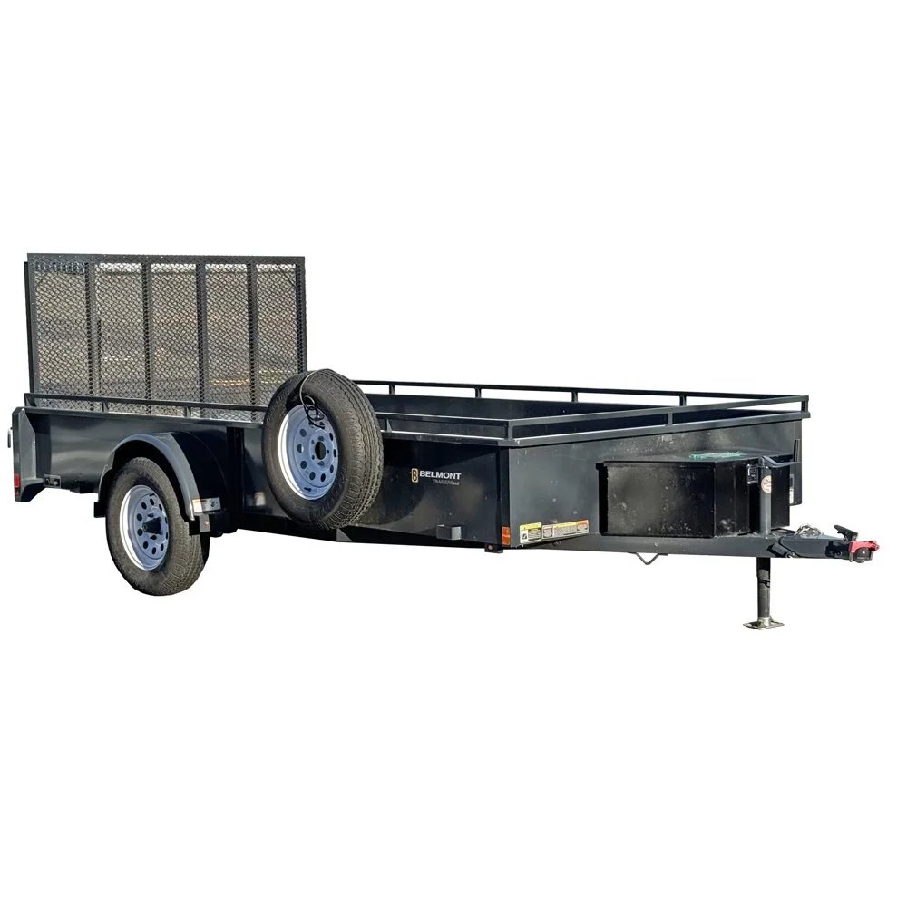 Black utility trailer with two wheels, a spare tire mounted on the side, and a metal mesh gate at the rear, isolated on white background.