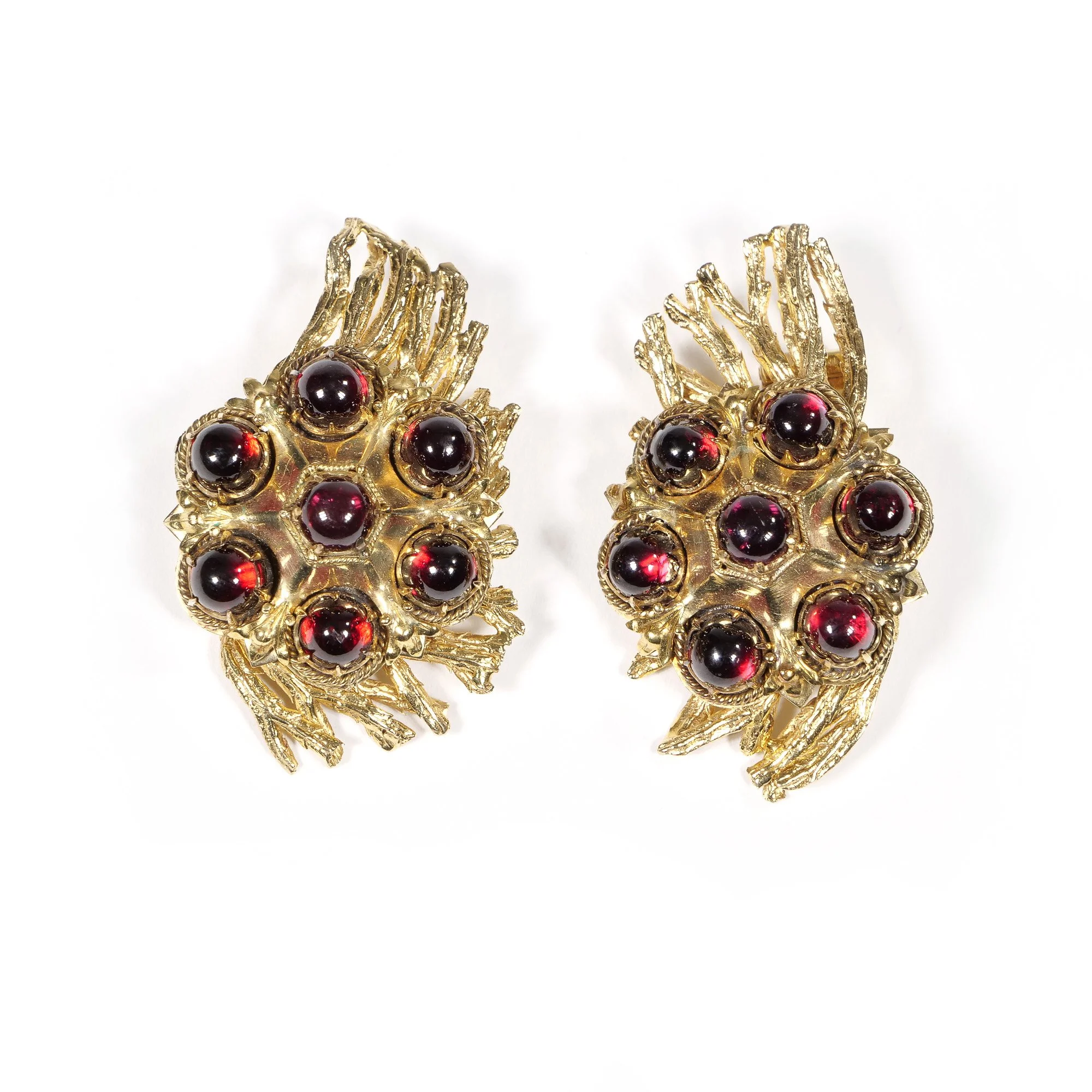 Pair of vintage gold-tone clip-on earrings with red and black beaded accents, designed to resemble a floral motif, against a white background, auctioned and photographed by ACES Gallery.