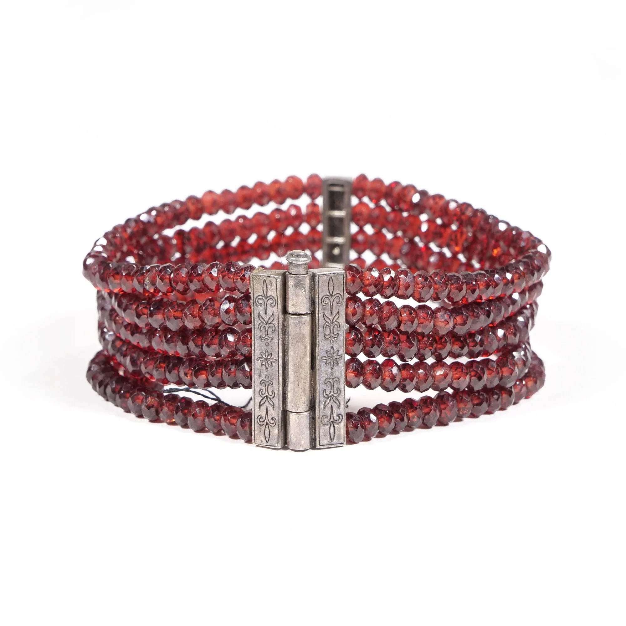 Red gemstone beaded bracelet with a silver hinged clasp, auctioned and photographed by ACES Gallery.