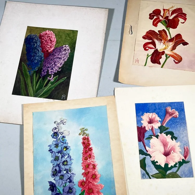 Collection of five watercolor paintings of different flowers on a flat surface, auctioned and photographed by ACES Gallery.