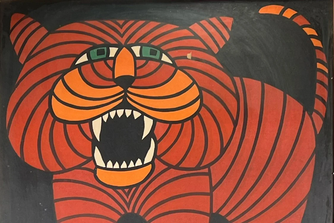 A colorful poster of a fierce tiger with green eyes, open mouth showing sharp teeth, and black and orange striped fur, auctioned and photographed by ACES Gallery.