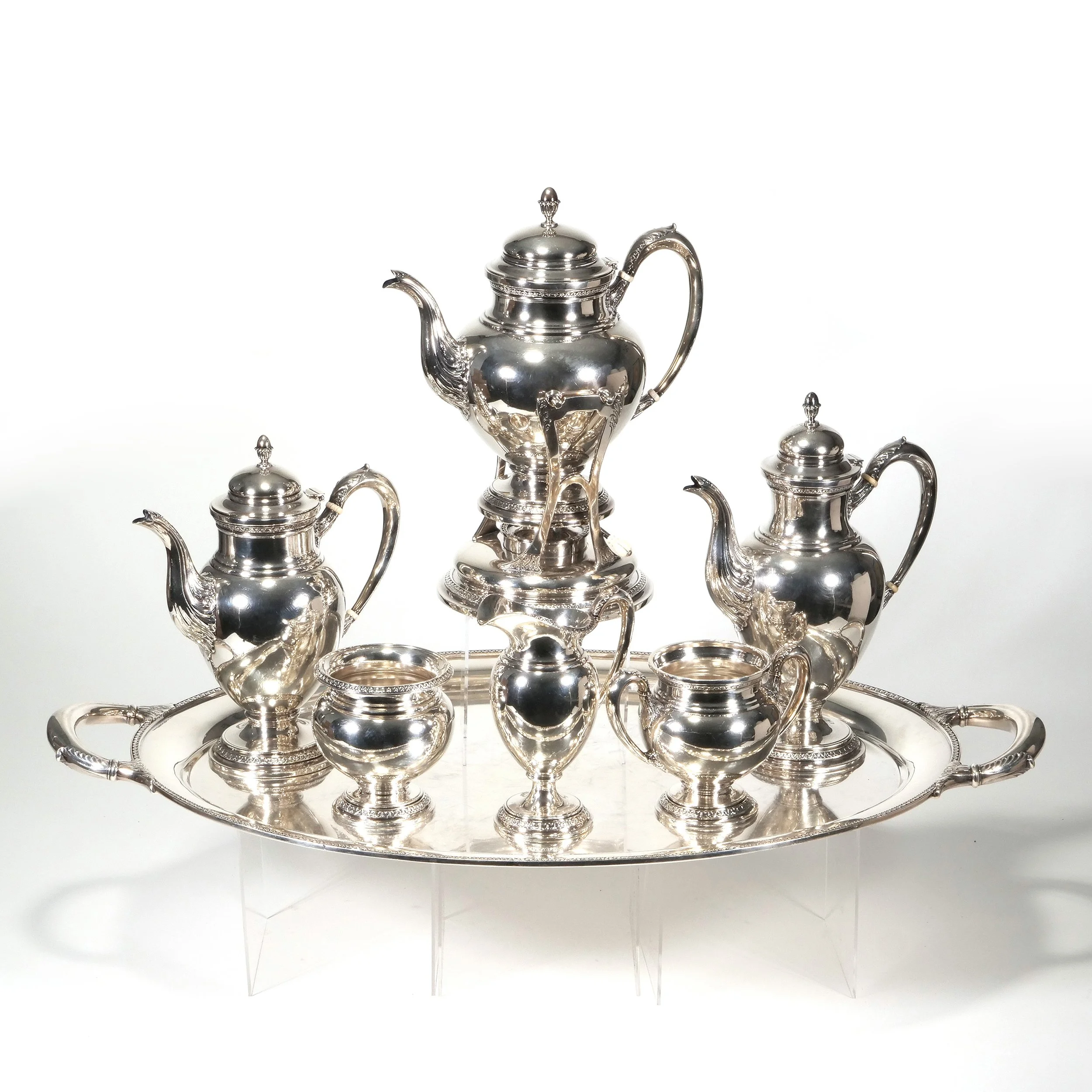 A sterling silver tea and coffee service auctioned and photographed by ACES Gallery.