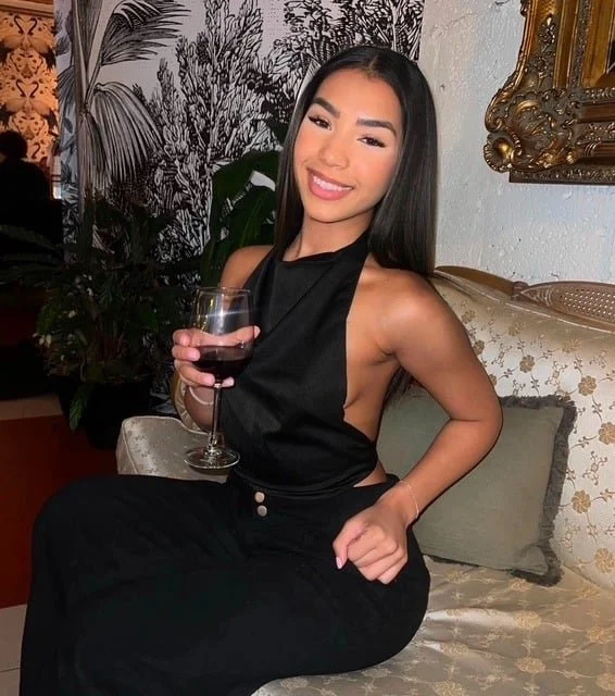 Beautiful Magie guest drinking red wine