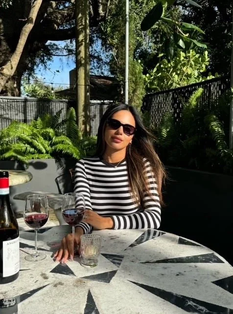 Magie guest enjoying wine in the garden