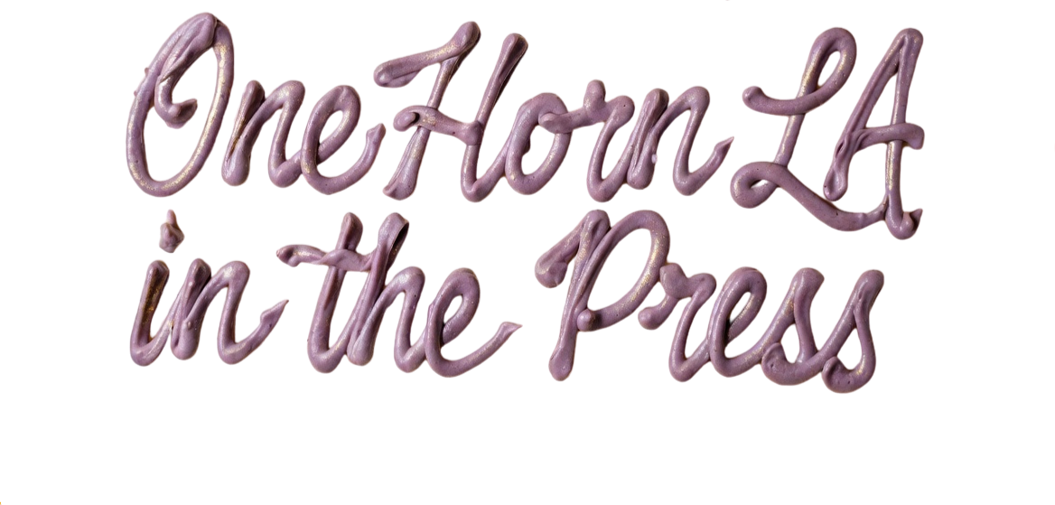 Pink, cursive text reading "One Hour At The Press" with a red arrow pointing to the right.