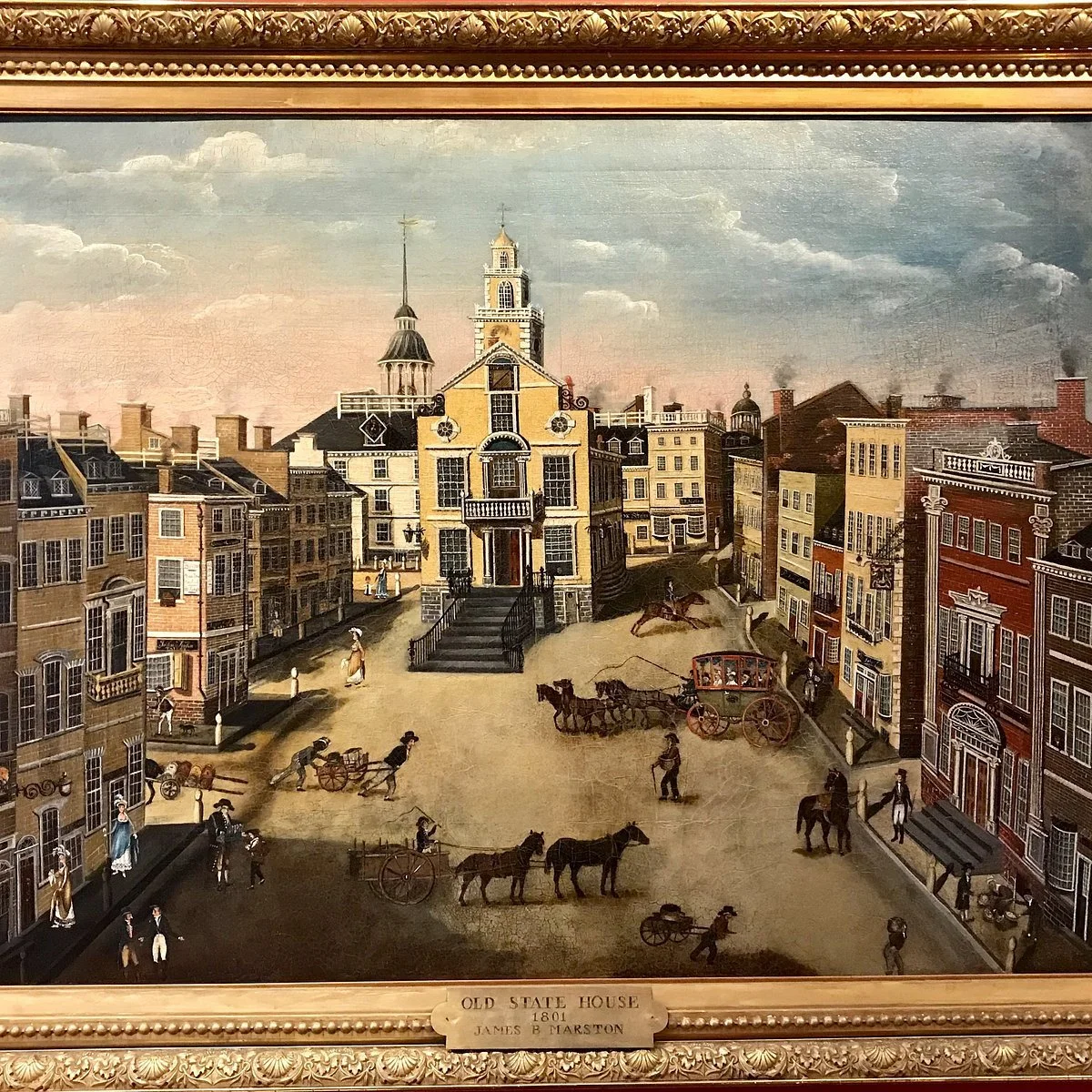 Painting of a historic town square with old buildings, horse-drawn carriages, and people walking, titled 'Old State House 1801 James B Marston'.