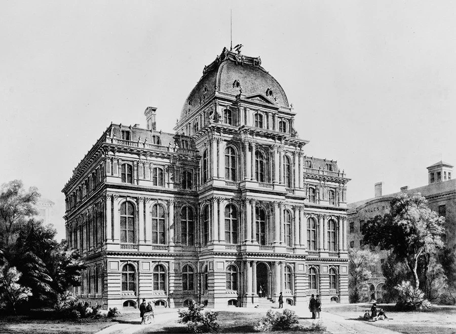 A black and white photo of a large, historic, multi-story government building with ornate architecture and a domed roof, surrounded by trees and a few people walking in front.