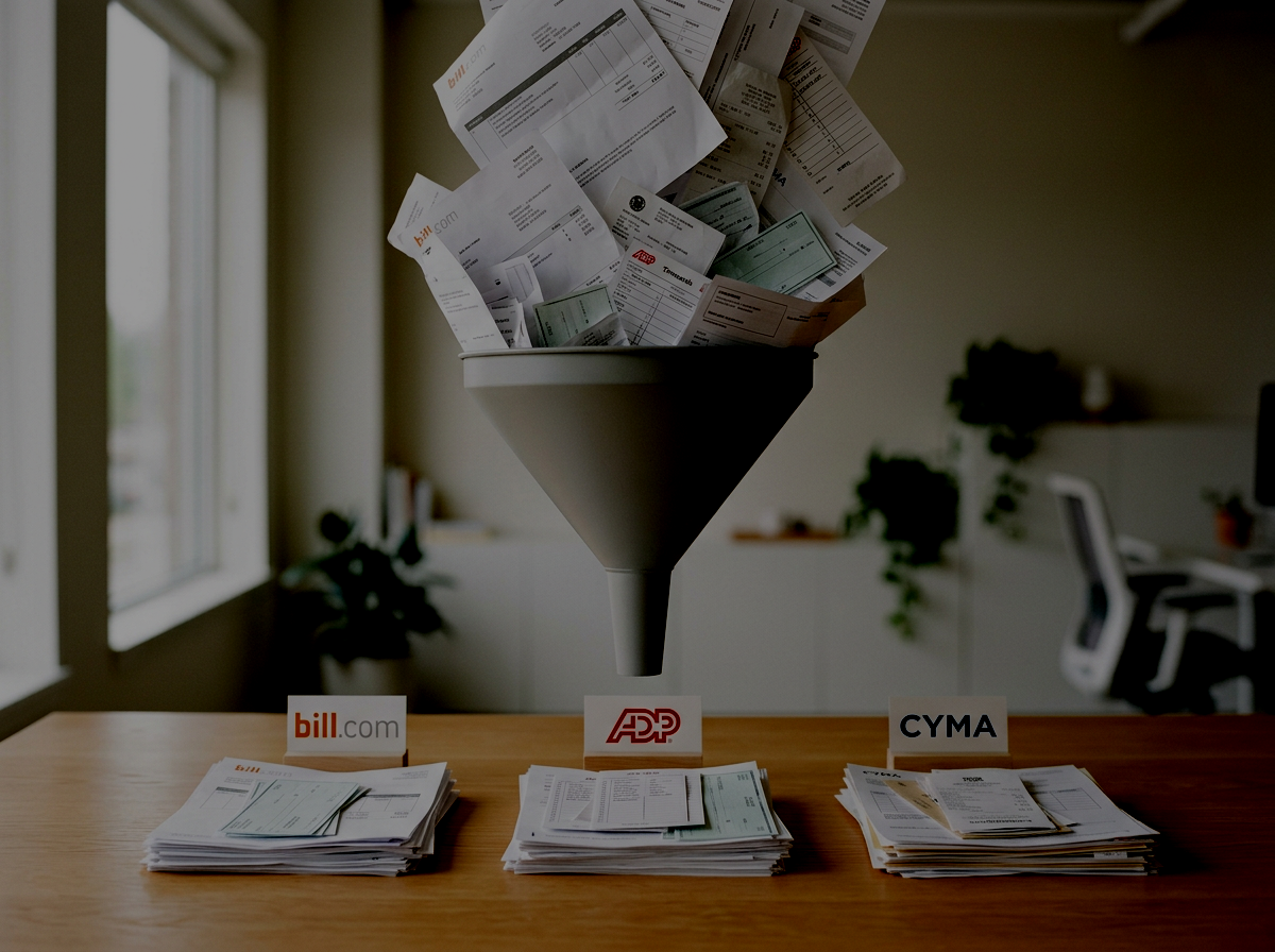 A large funnel on a wooden table collecting various receipt papers, timesheets, and bills from three different sources, funneling through and landing in neat stacks labeled bill.com, ADP, and CYMA below the funnel.