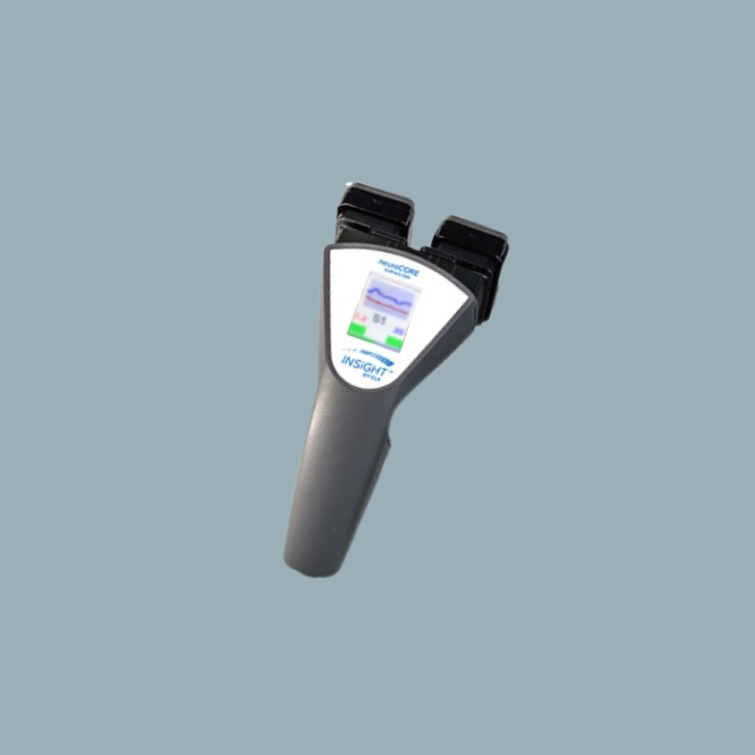 Medical device with display screen and multiple connectors against a light blue background.