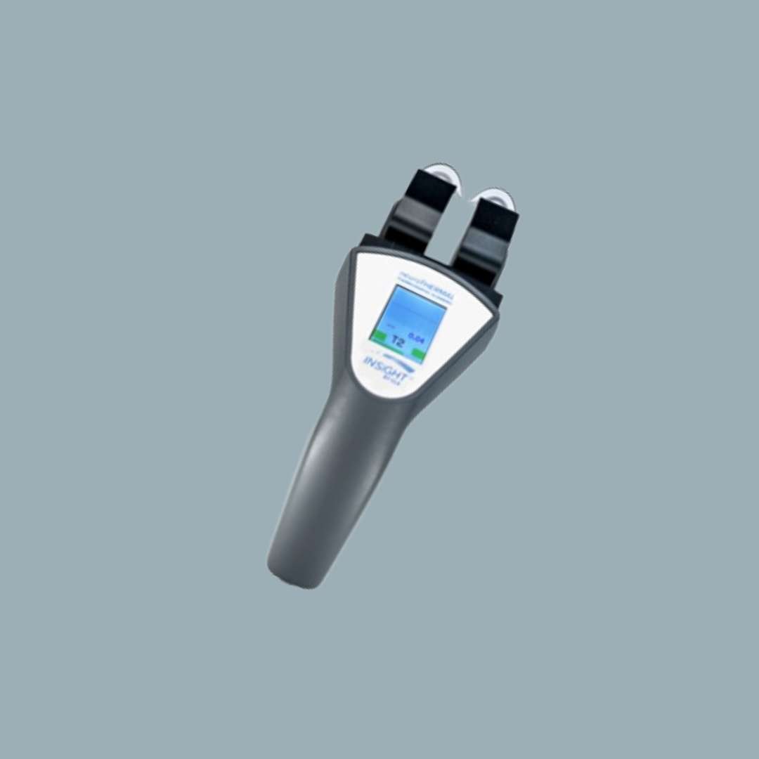 A handheld medical device, likely a pulse oximeter, with a digital screen and sensors at the top, isolated on a plain background.