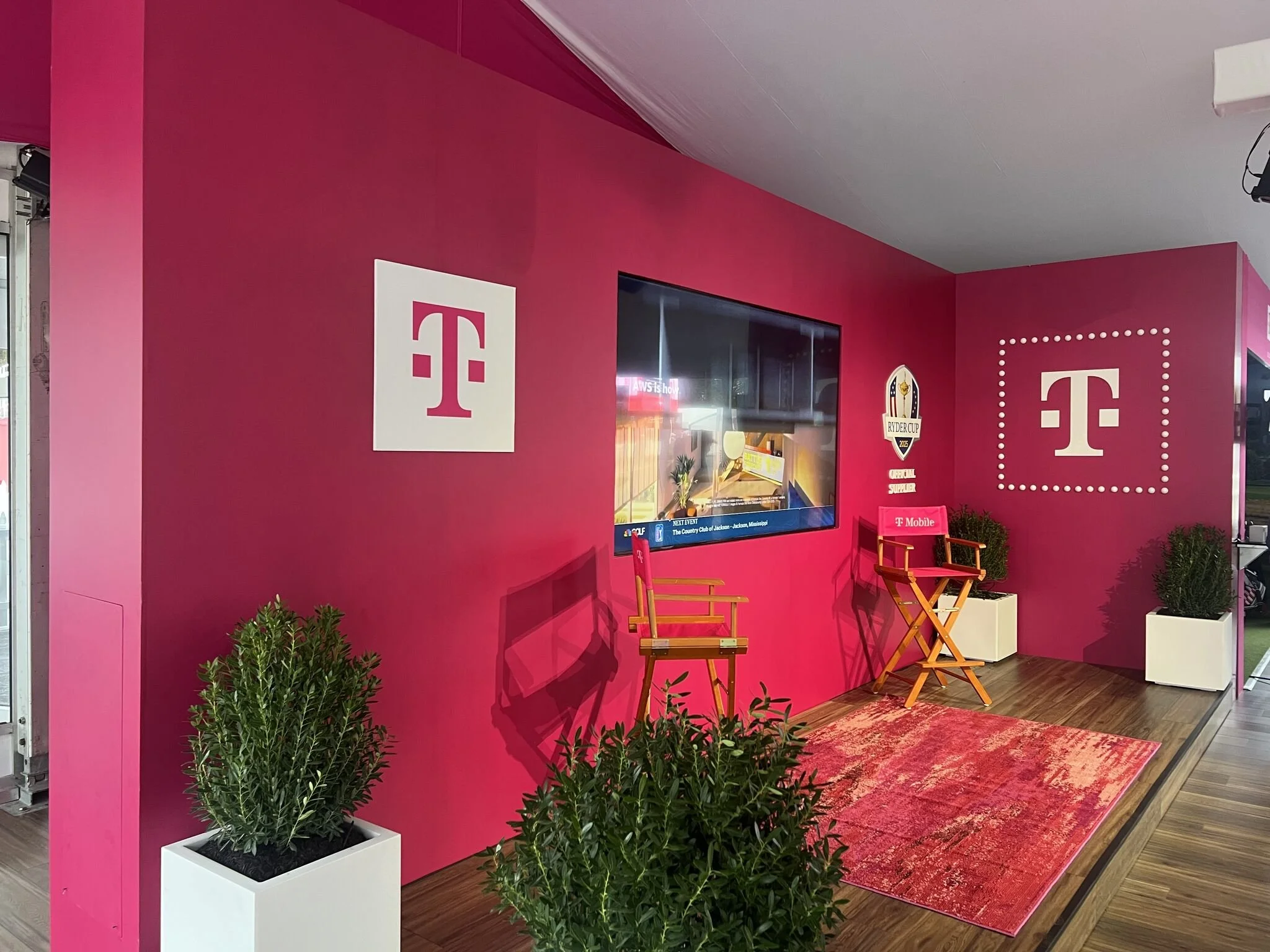 pop-up pink background, two director chairs, t-mobile logo