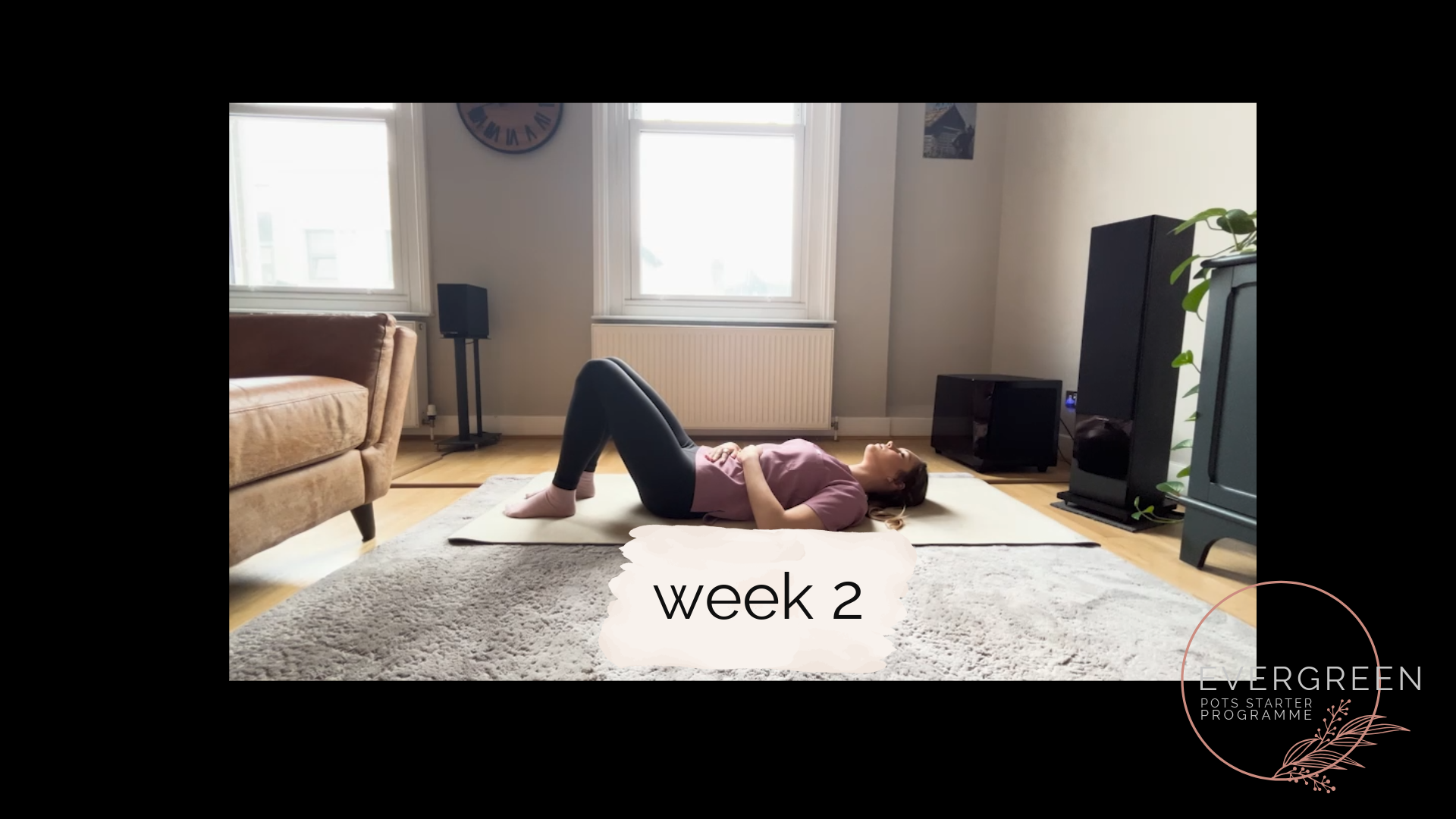 A woman lying on her back on a yoga mat in a living room, demonstrating exercise at week 2 of a program.  POTS course, dysautonomia course, chronic illness training program, POTS strength training course, online POTS support, POTS education.