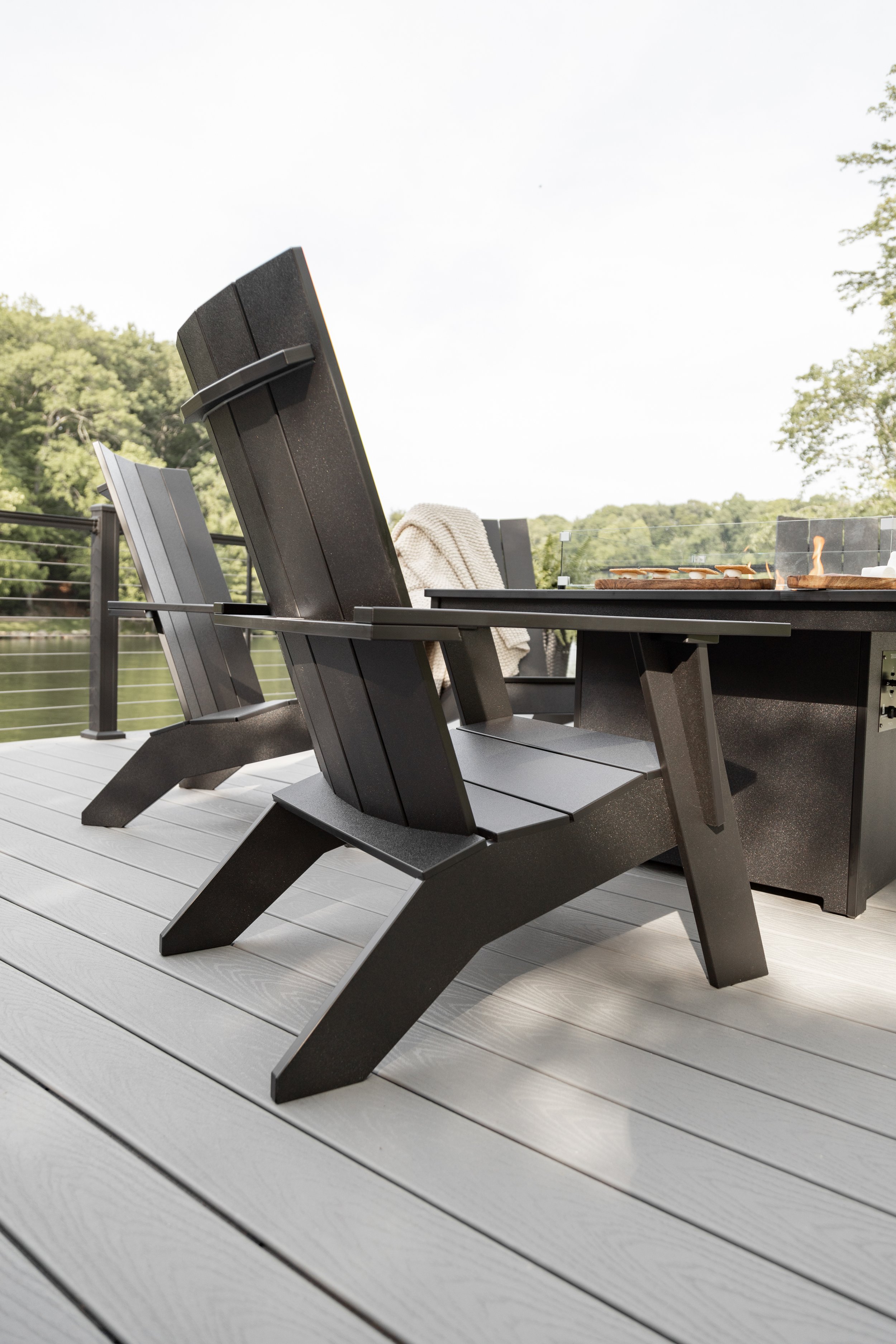 Nordic Adirondacks around Numa Firepit in Matte Black with Black Hammer Top 3.jpg