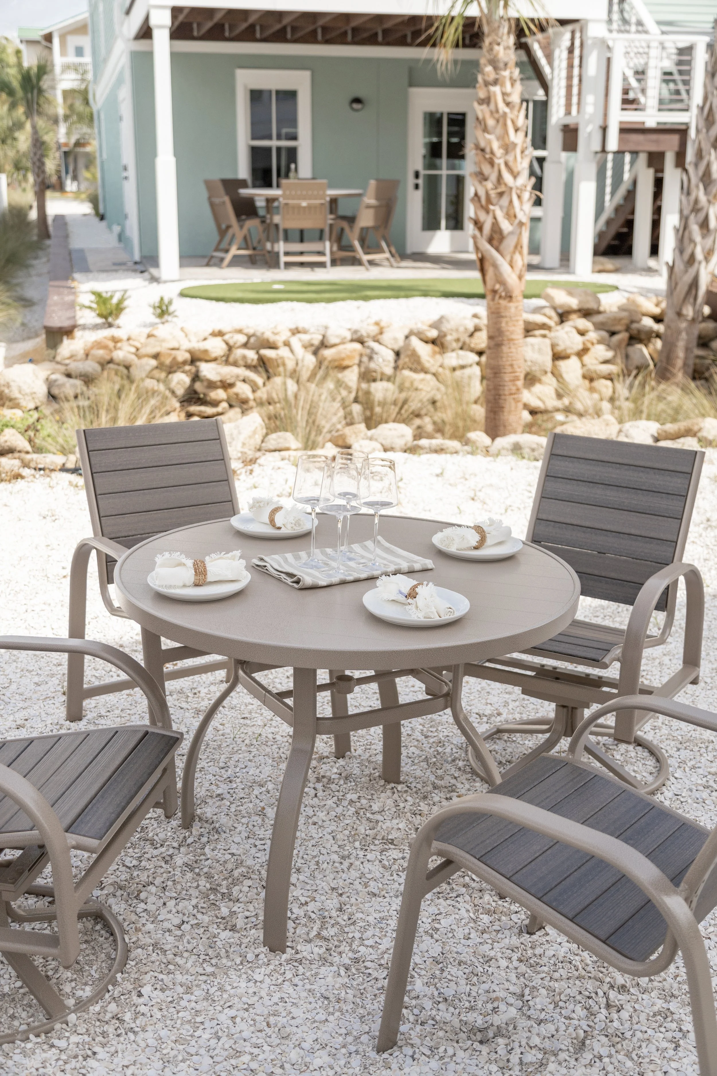 Murphy 42” Round Dining Table in Oak Wood Vein. Murphy Poly Dining Chairs and Murphy Poly Swivel Rocker Dining Chairs in Oak Wood Vein with Coastal Gray poly.jpg