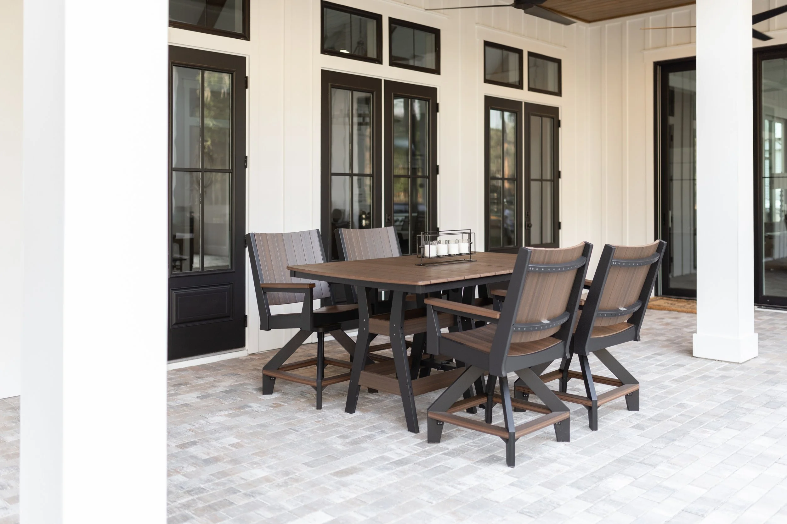 Harbor 44” x 72” Rectangular Counter Table in Brazilian Walnut on Black. Mayhew Chat Swivel Counter Chairs in Brazilian Walnut on Black.jpg