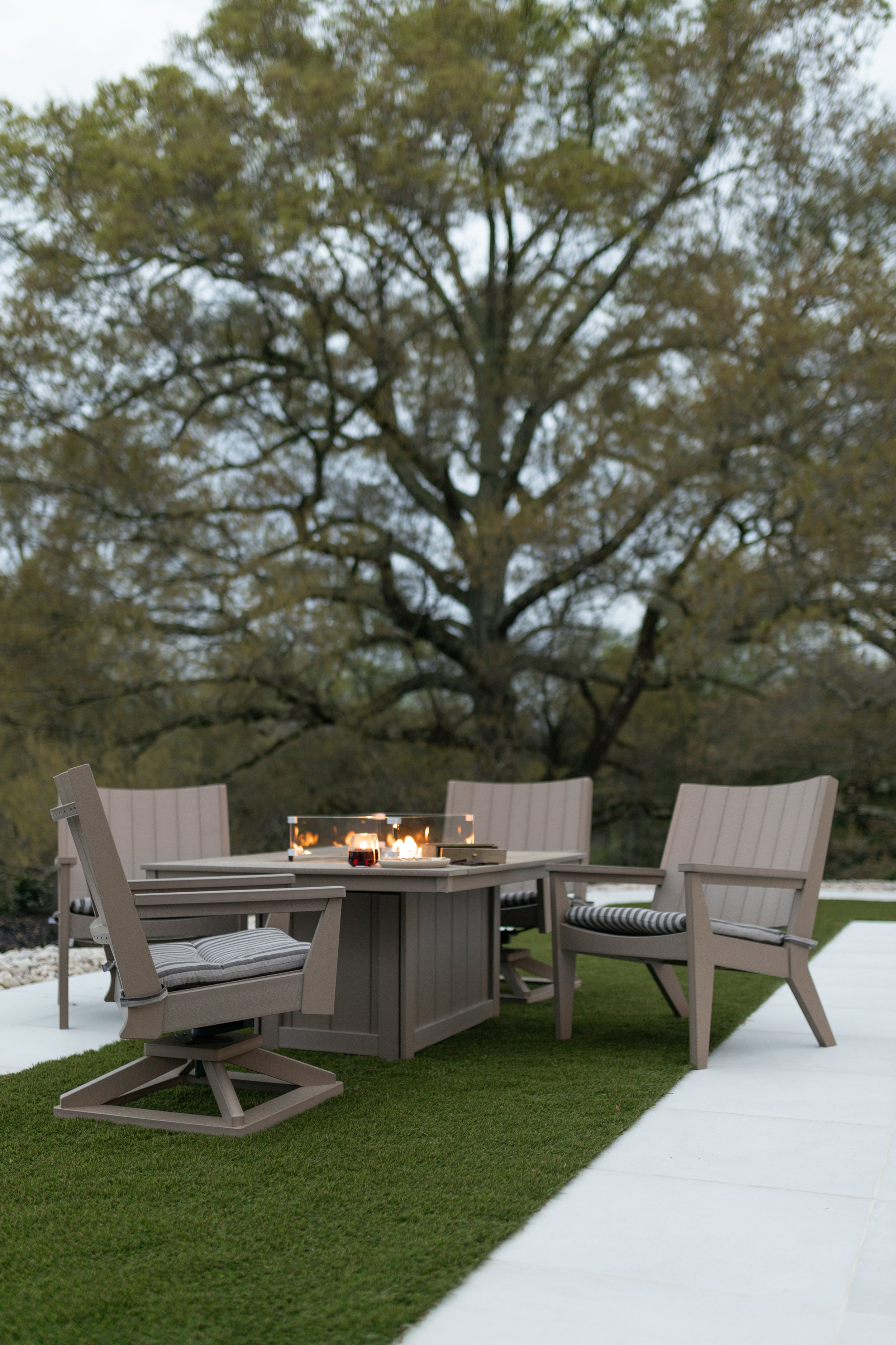 Mayhew Chat Chairs & Swivel Rockers with Donoma in Weatherwood. Seat Cushions in Sail Away Java