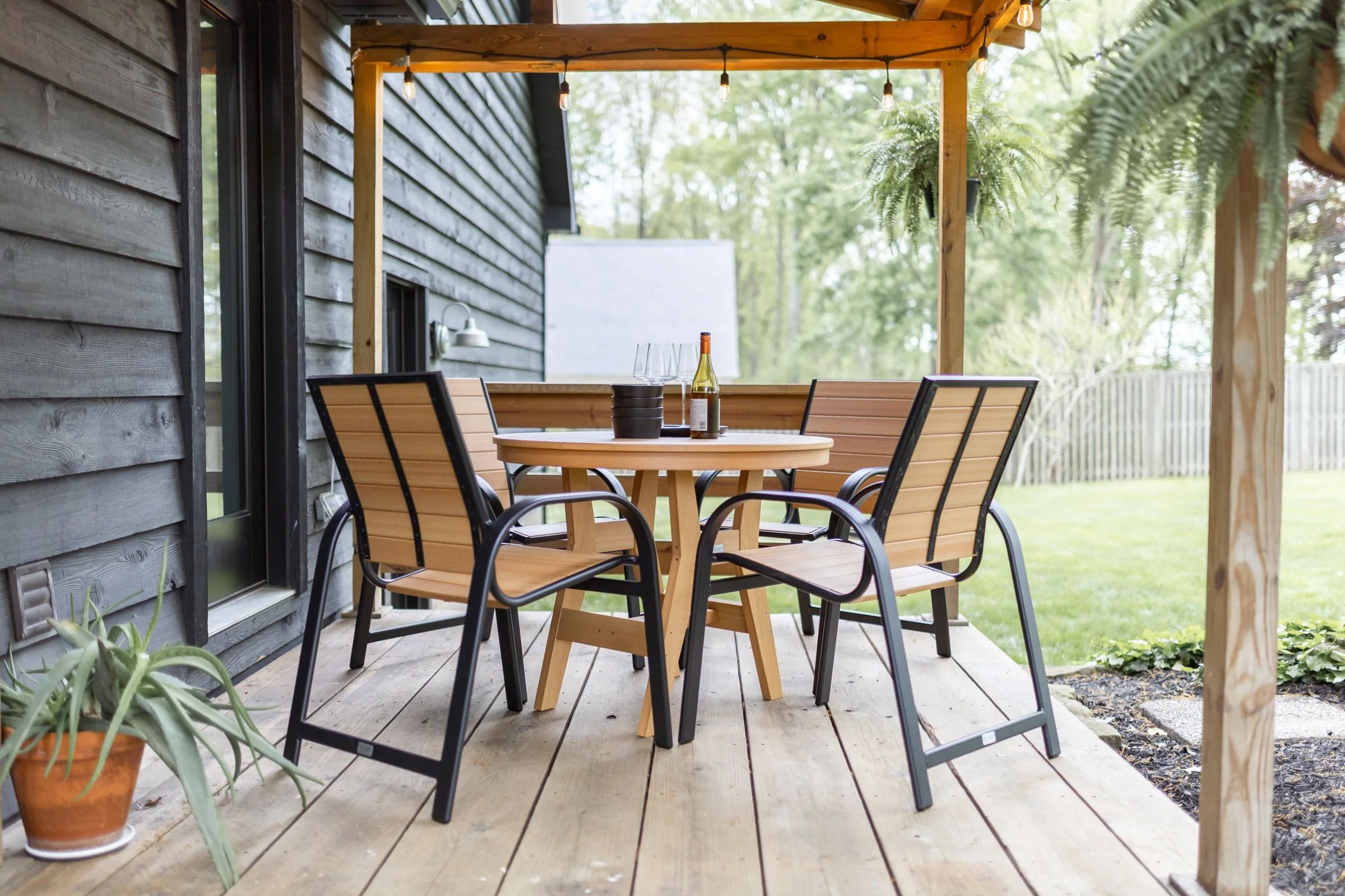 Harbor 38 Dining Table in Natural Teak. Murphy Black and NT dining chairs (2).jpg