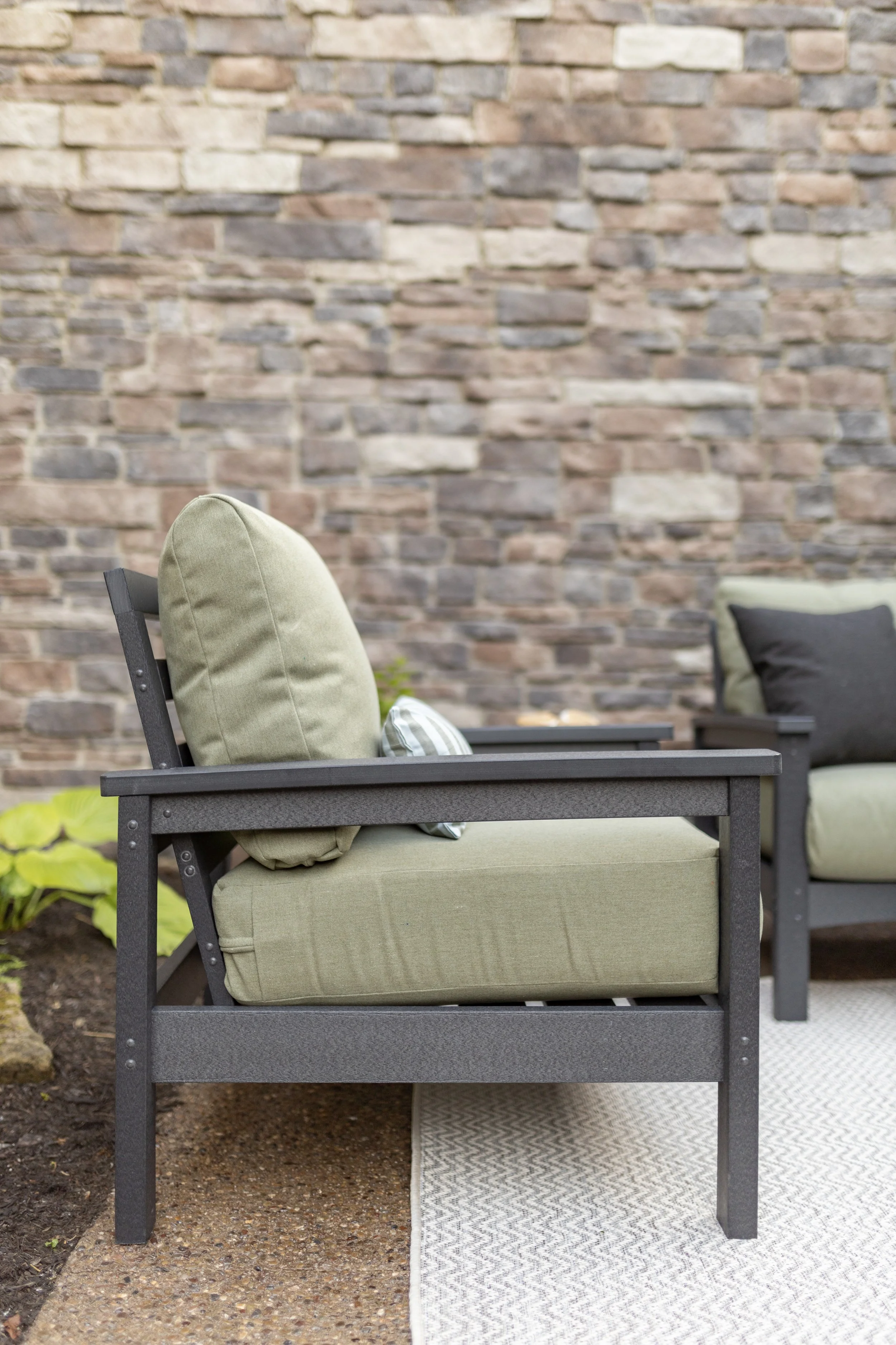 Camden Club Chair and Camden Loveseat in Smoke Gray. Cushions in Heritage Leaf with throw pillows in Heritage Char. Lumbar pillows and LilyHive Rectangular Pouf in Sail Away.jpg
