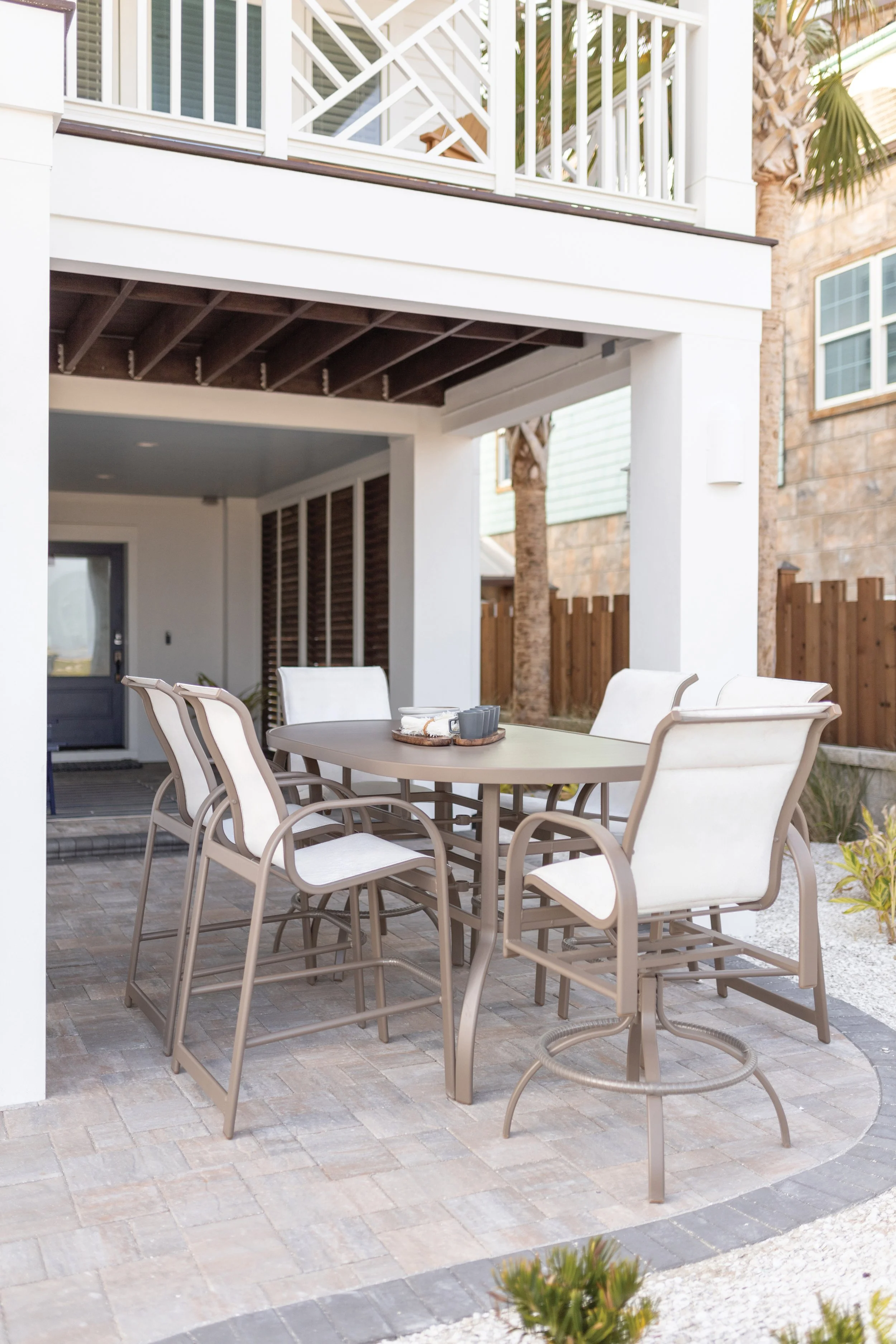 Murphy 42” x 76” Oblong Bar Table in Clay with Murphy Sling Bar Chairs and Murphy Bar Height Padded Sling Swivel Chairs in Clay, sling in Sailing Salt. (2).jpg