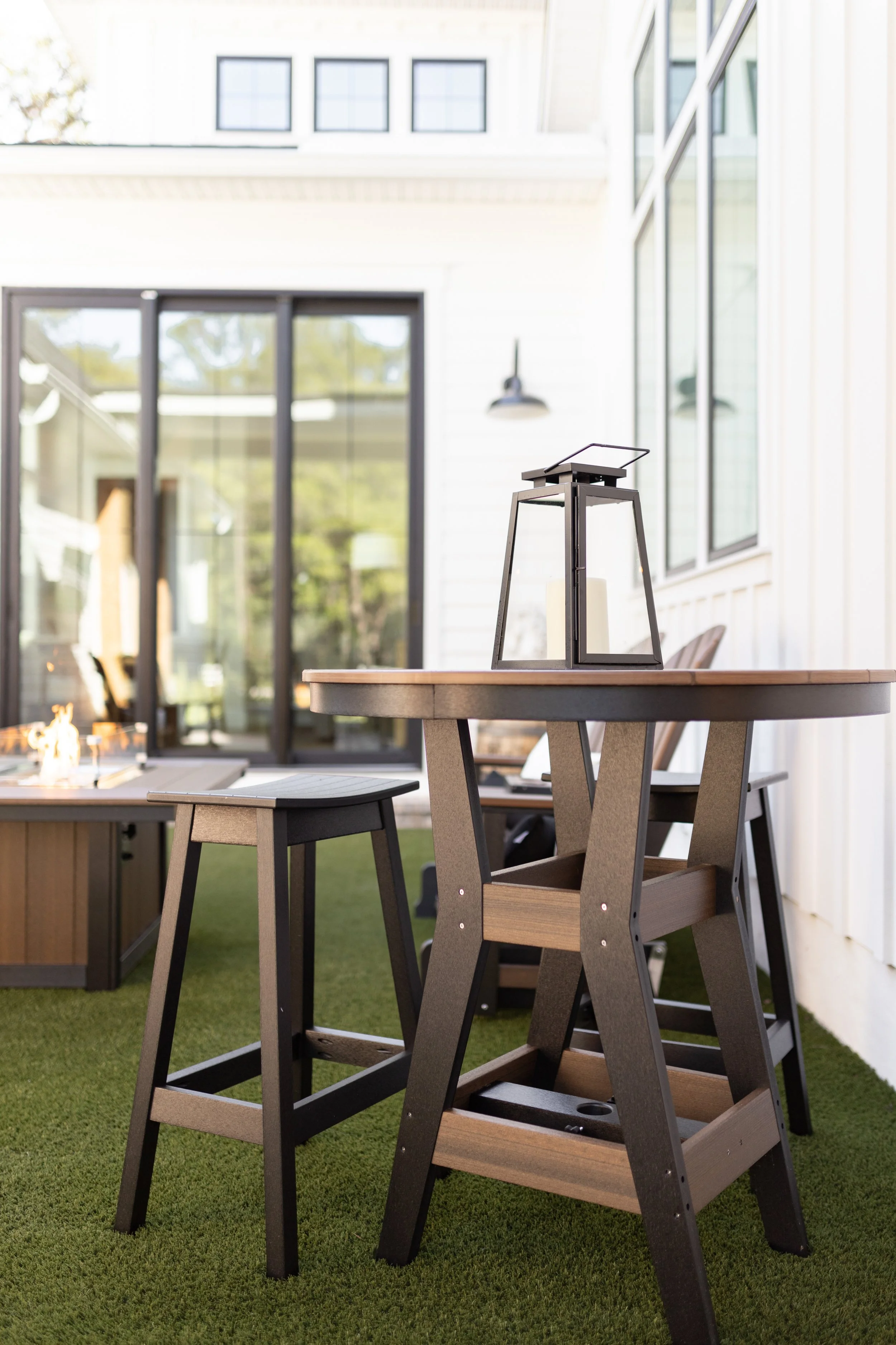 Harbor 38” Round Bar Table in Brazilian Walnut on Black with Saddle Barstool in Black.jpg