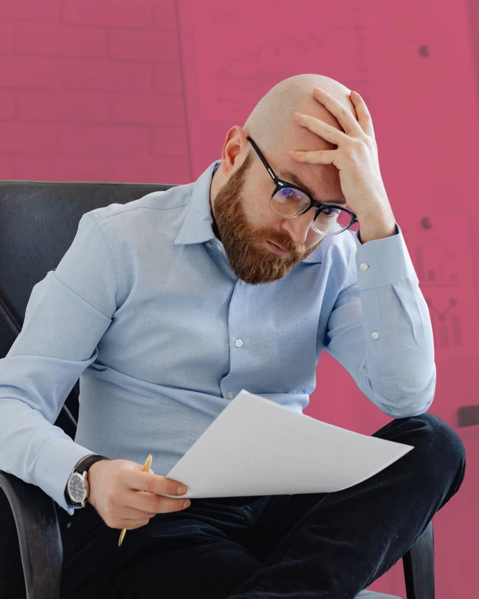 Man with glasses holding a paper and a pencil, sitting in a chair, with a worried or stressed expression, head resting on hand, in an office setting.