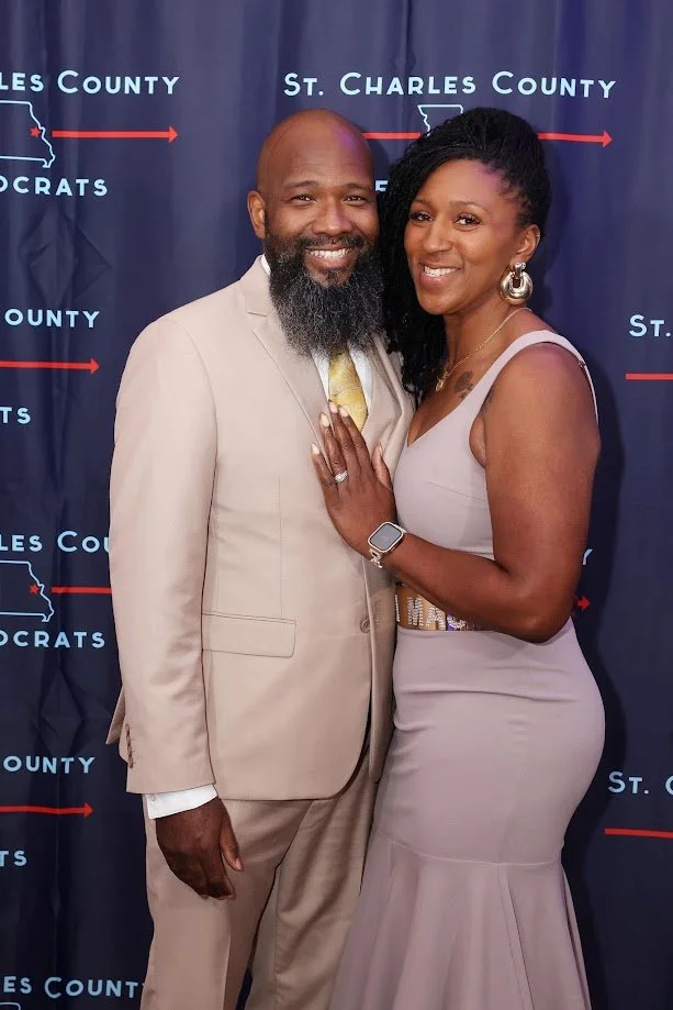 Don and Zebrina in front of banner.JPG