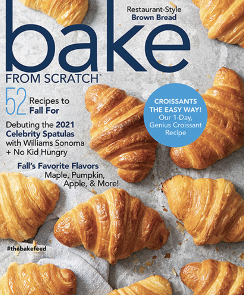 Cover of a baking magazine featuring multiple croissants, highlighting recipes for restaurant-style brown bread and easy croissants, with text emphasizing fall flavors like maple, pumpkin, and apple.