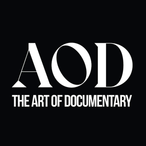 Logo for AOD, The Art of Documentary, featuring large white letters 'AOD' on a black background with a film apparatus attached to the 'A'.