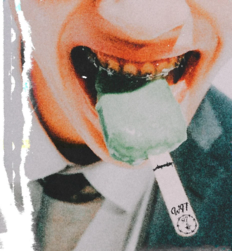 Person wearing a face mask with a valve, holding a green object in their mouth, smiling.