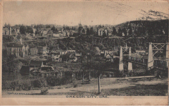 PC011 Oregon City, Ore. from Willamette (now part of West Linn).  At left is Clackamas County Courthouse, cornerstone laid June 26, 1884.  At right is suspension bridge built in 1888, the first true suspension bridge west of the Mississippi.  Huntley