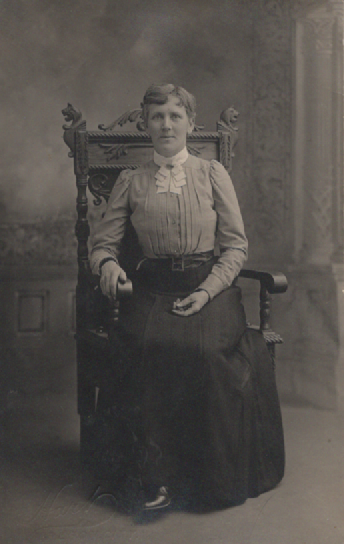 PC020  Unknown person, photograph taken by Preston Mitchell Hart (1868-1959) who operated a studio at 10th and Main in Oregon City during the early 20th century.  His logo is at the bottom left of the image.