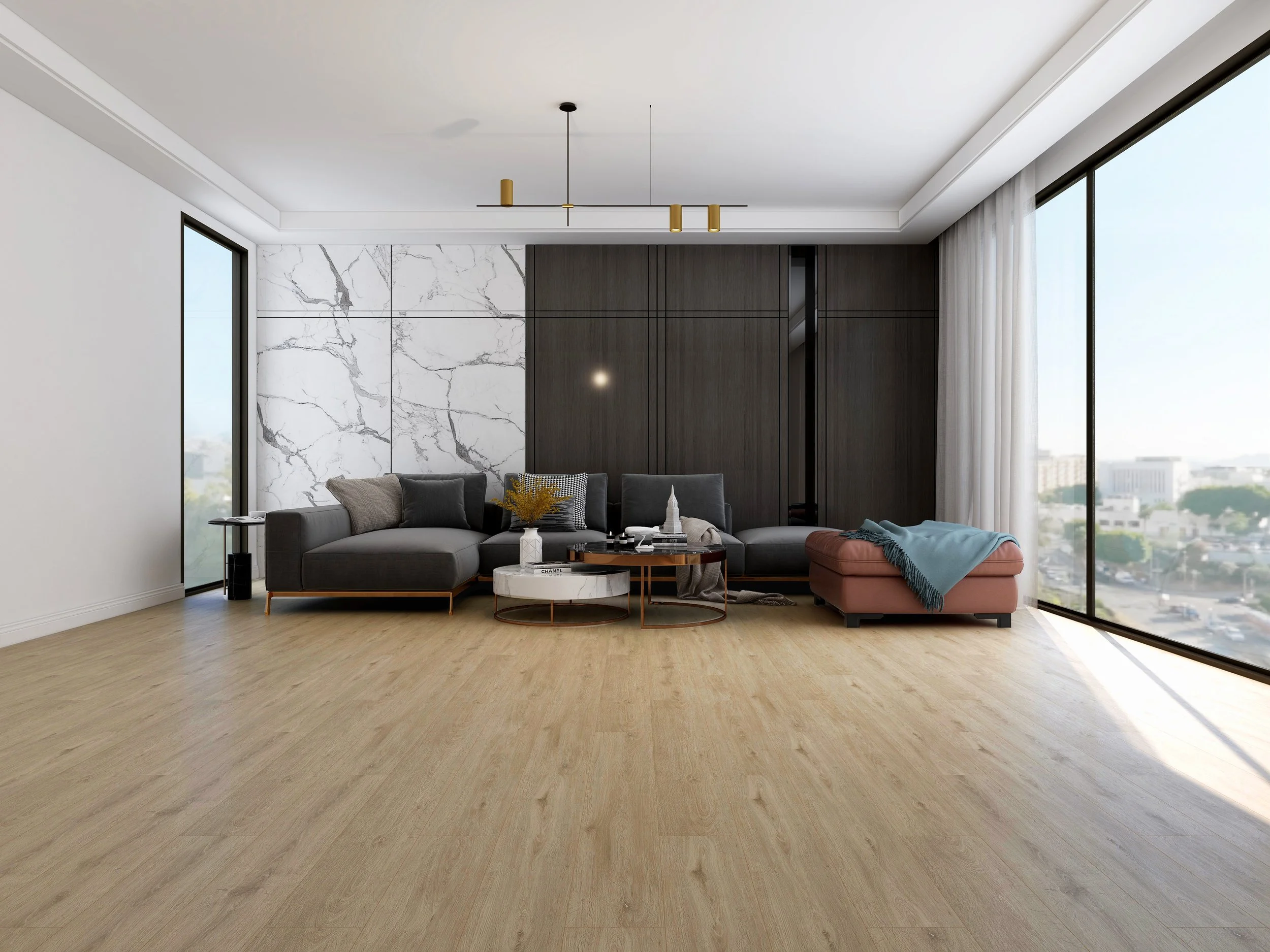 Modern living room with large windows, wooden flooring, a gray sectional sofa, and a marble accent wall.