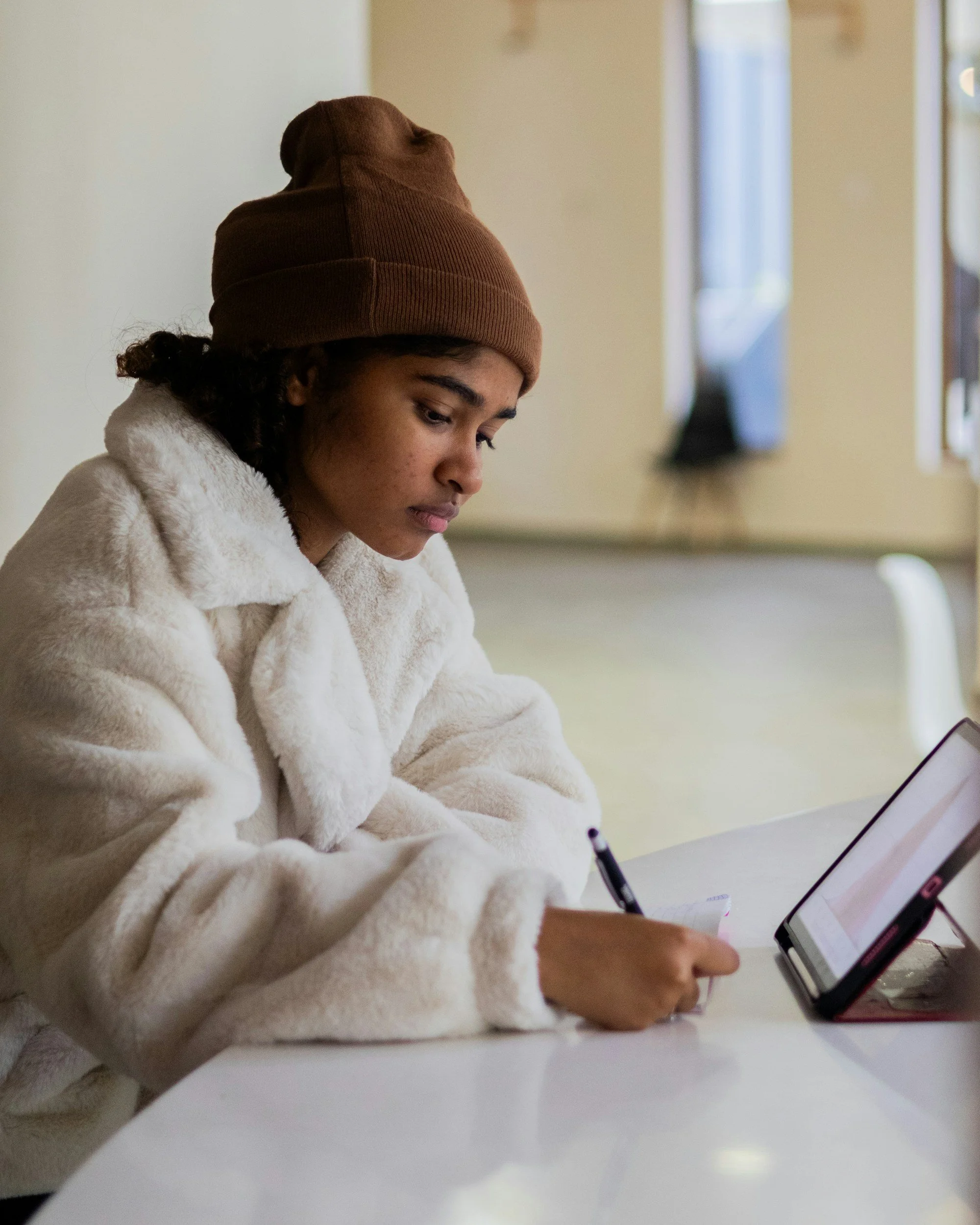 girl writing in journal