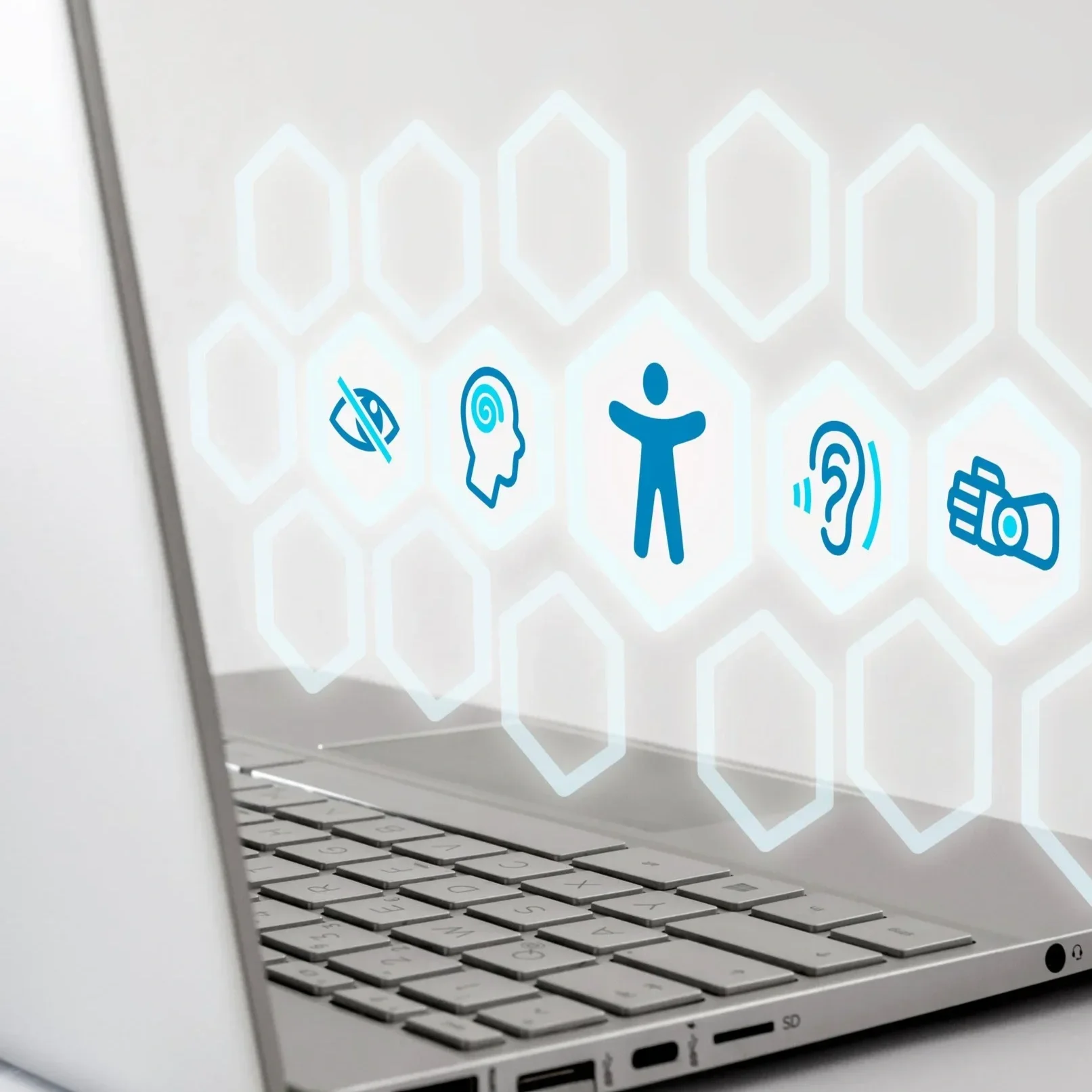 Laptop keyboard with digital icons of an eye, head, person, ear, and megaphone floating above the keyboard.