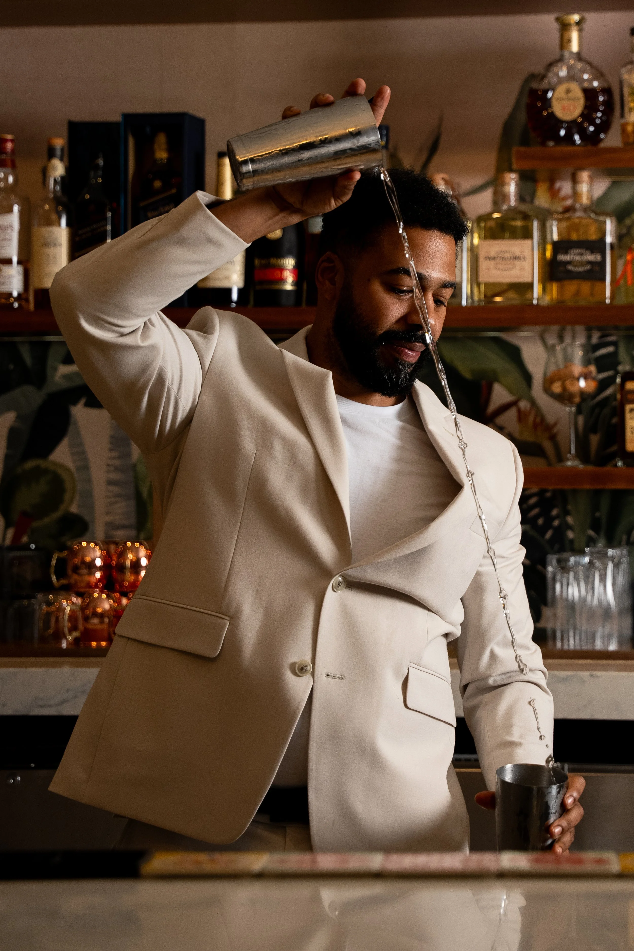 Edward Hernandez at Amalfi Palm Beach mixing a cocktail.