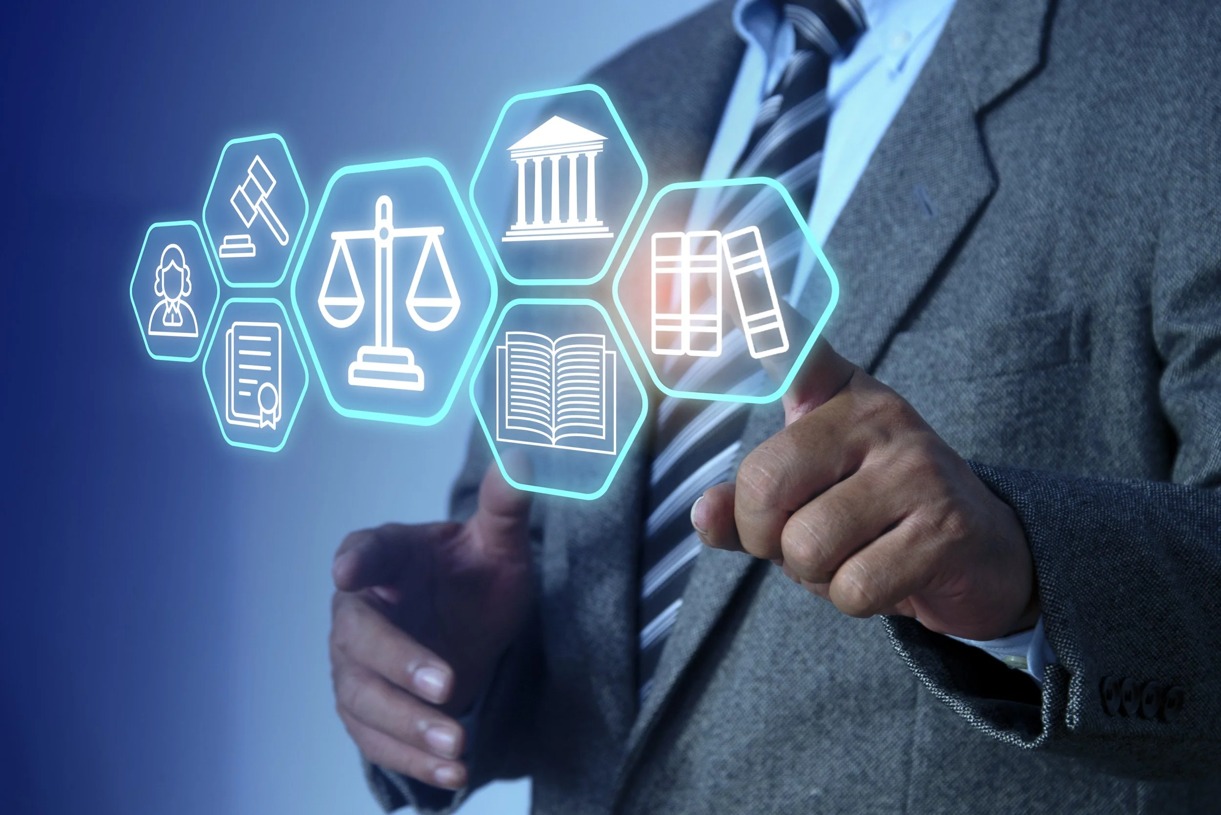 Businessperson in suit pointing at a digital hologram of legal icons, including scales of justice, a courthouse, and legal books.