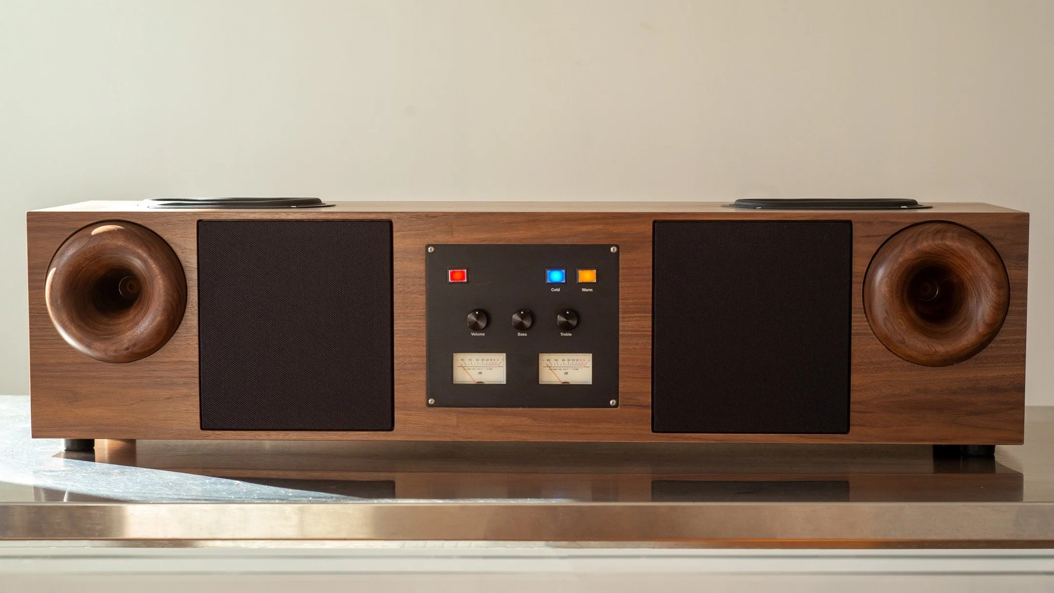 WESTERN ACOUSTICS TYPE 2 CONSOLE

A client asked us to create a custom walnut console version of our Type 2 speaker for his office. We had some fun with it and added EQ knobs, VU meters, and two EQ buttons for "warm" and "cold" pr