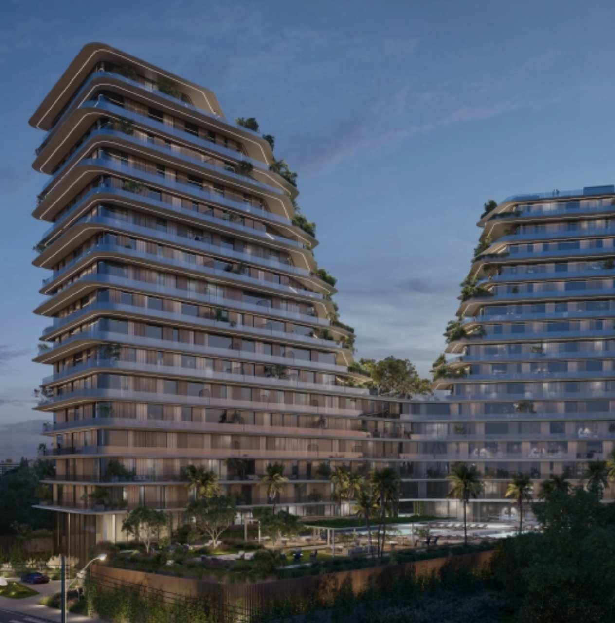 Modern high-rise residential buildings with glass balconies and greenery, set against a twilight sky.