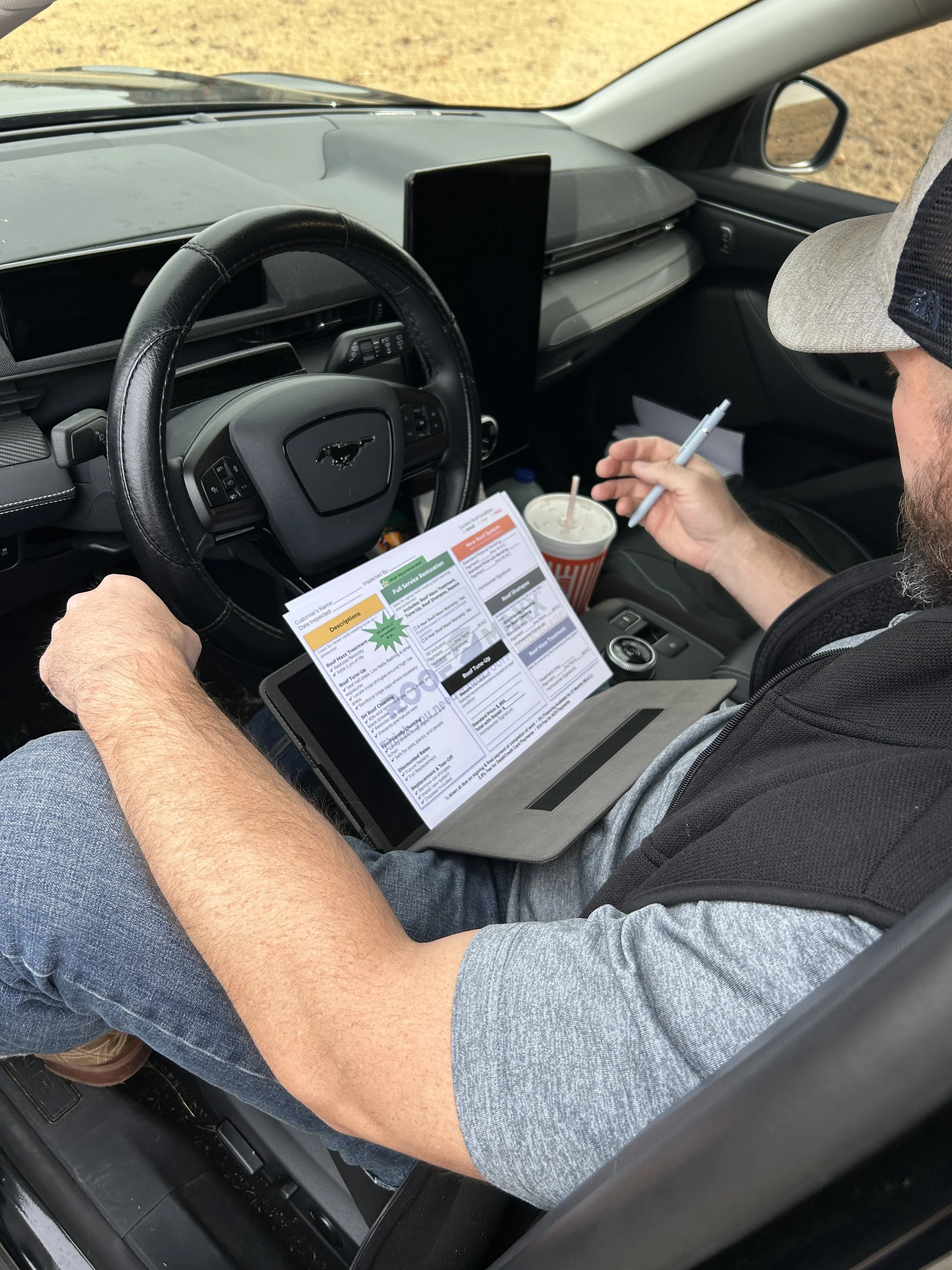 Roofer preparing quote