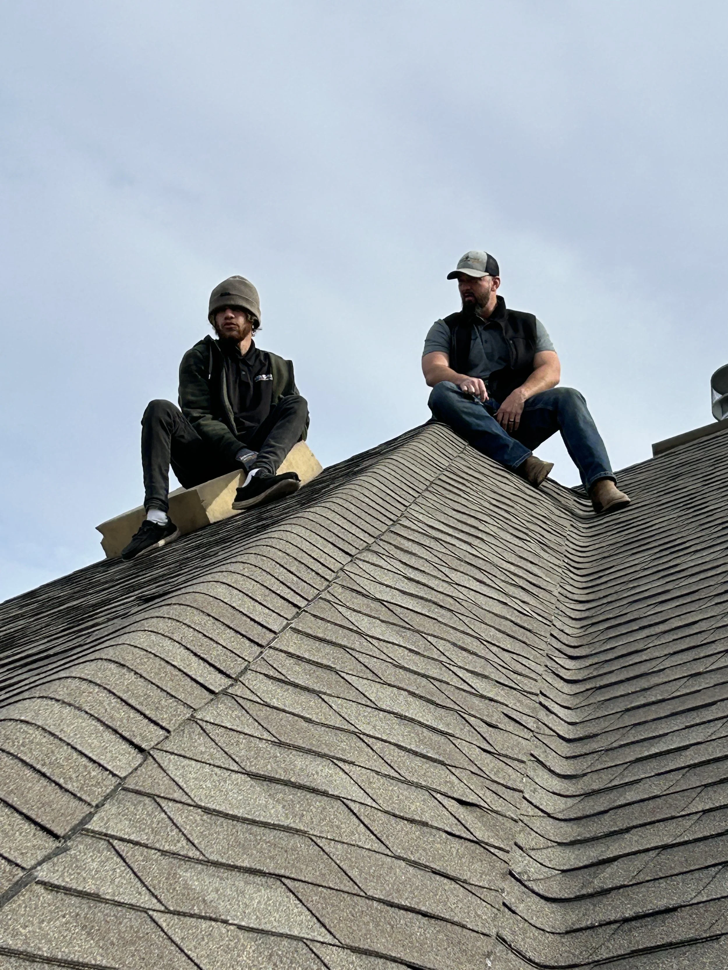 men reviewing roof