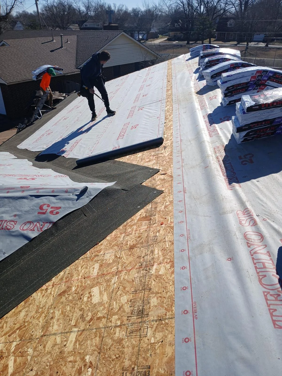 Roofing Installers replacing roof in tulsa
