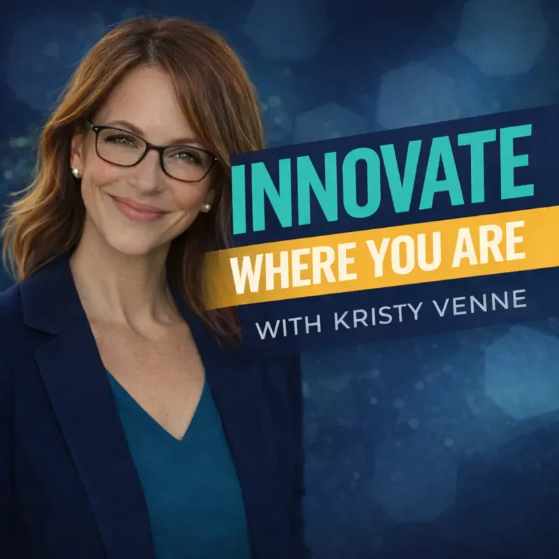 Portrait of a smiling woman with red hair, glasses, and pearl earrings, standing next to a sign that reads "Innovate Where You Are with Kristy Venne" against a blue background.