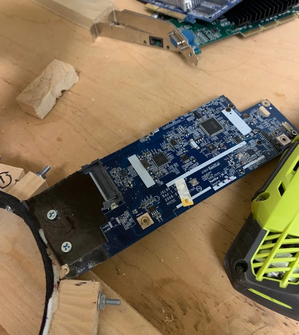 20220128230915-13490714-circuit-board-screwed-into-wooden-supports (1).jpg