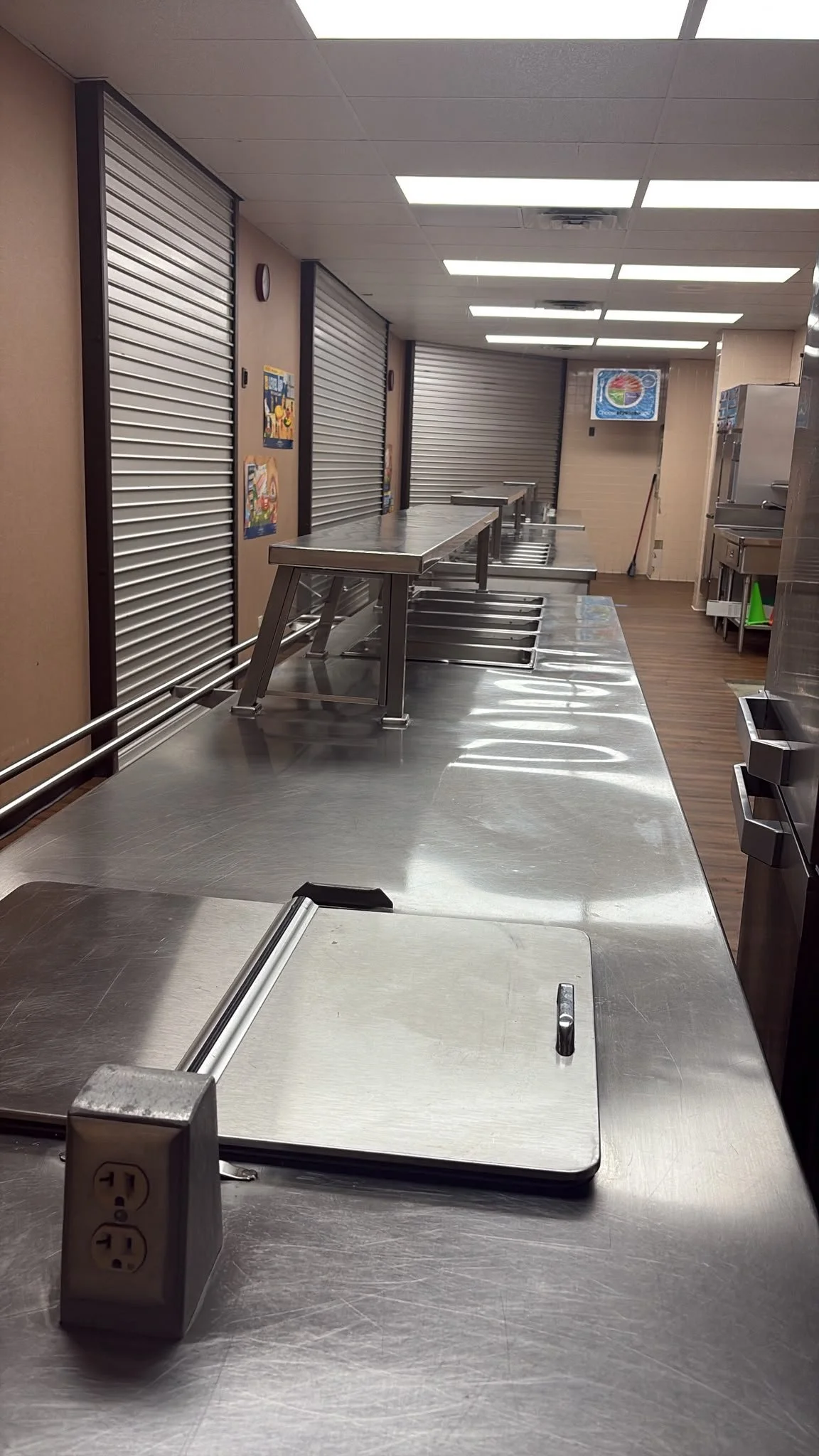 Clean stainless-steel cafeteria serving line after Bright Lars commercial school cleaning in Pottsboro, Texas