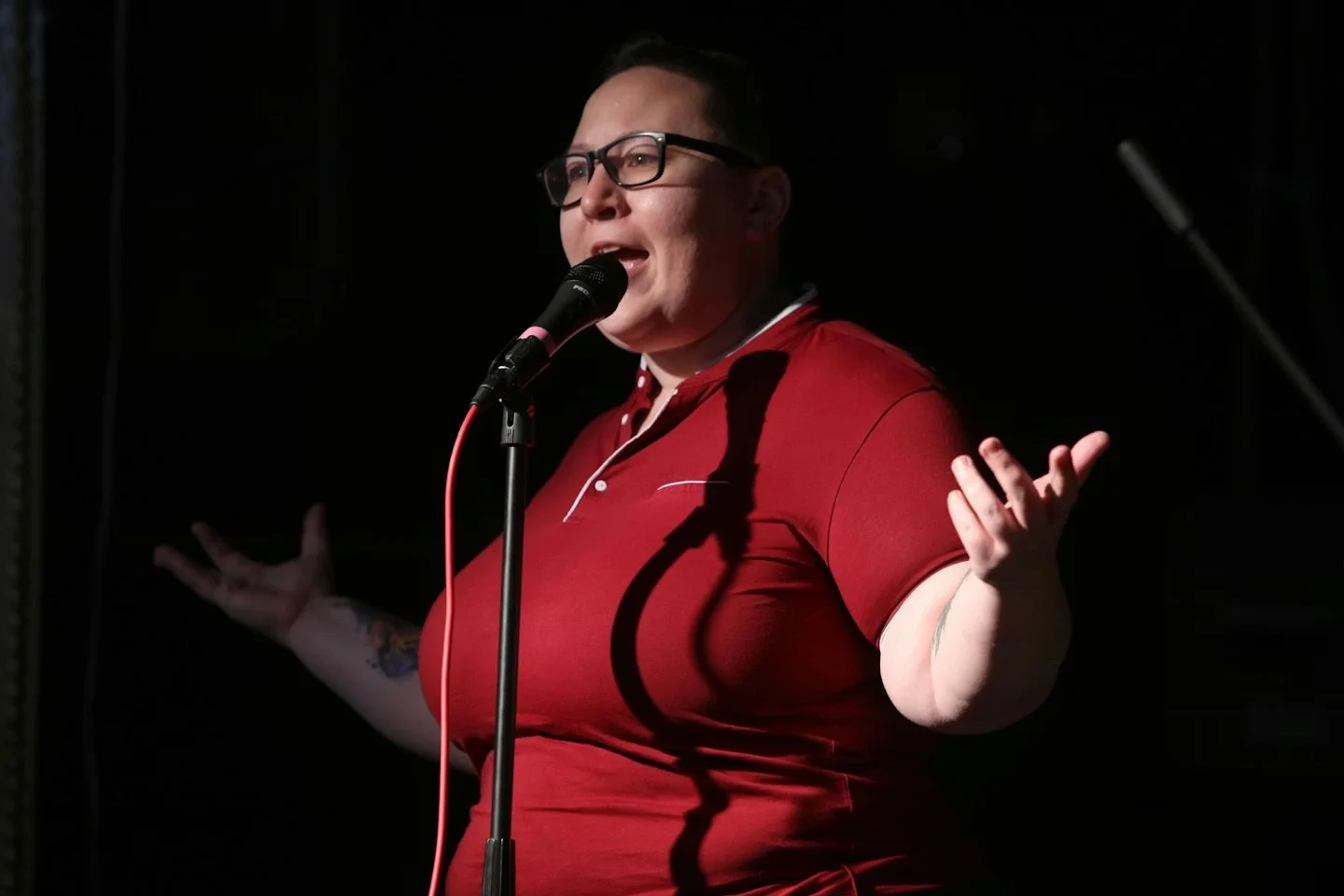 Mx. Asher performing spoken word at the Trans Artist Showcase in Boston 2025