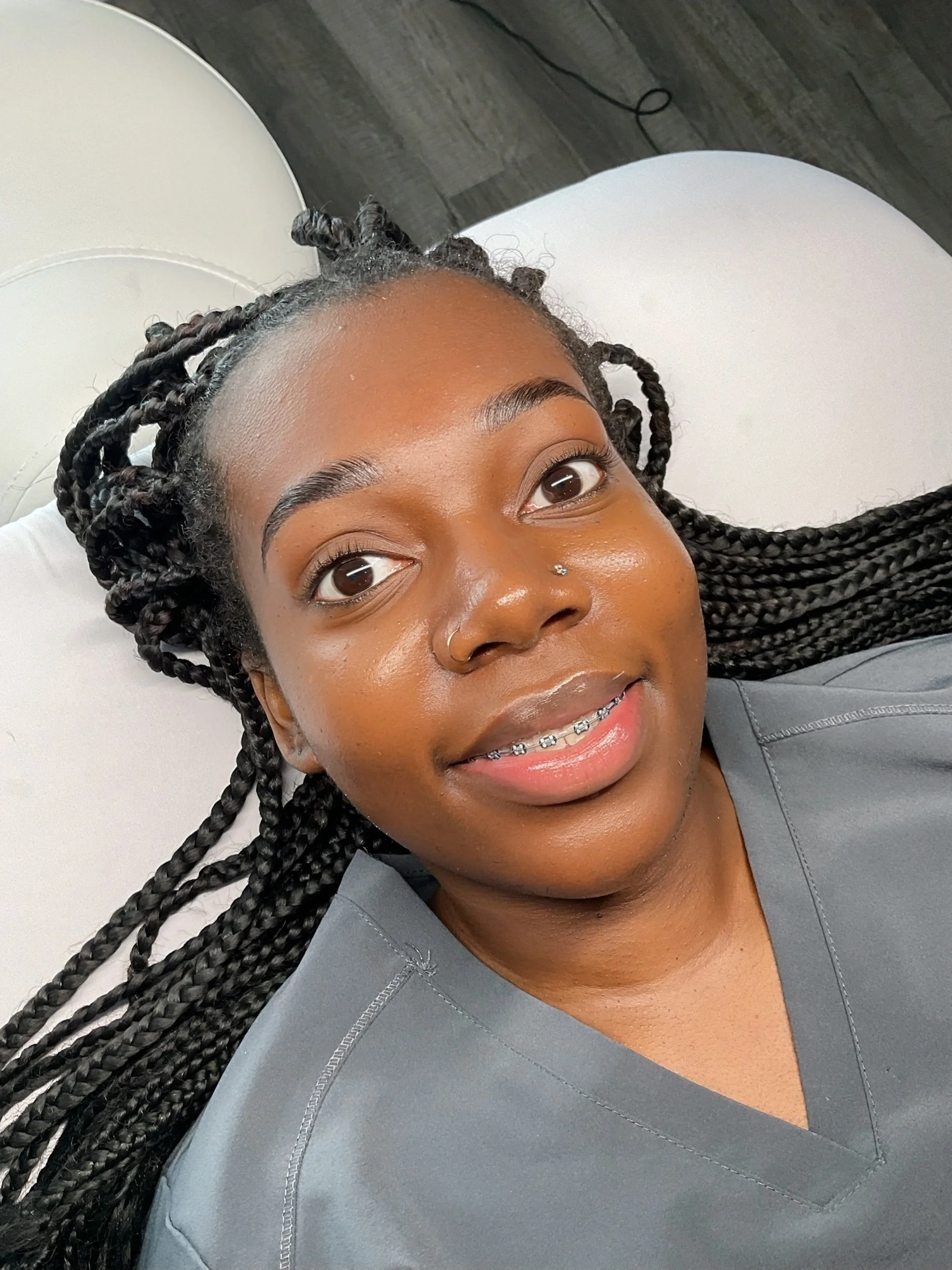 Enhanced brow after brow lamination, stain, wax, and brow mapping service at Glow Setters Skin Studio.